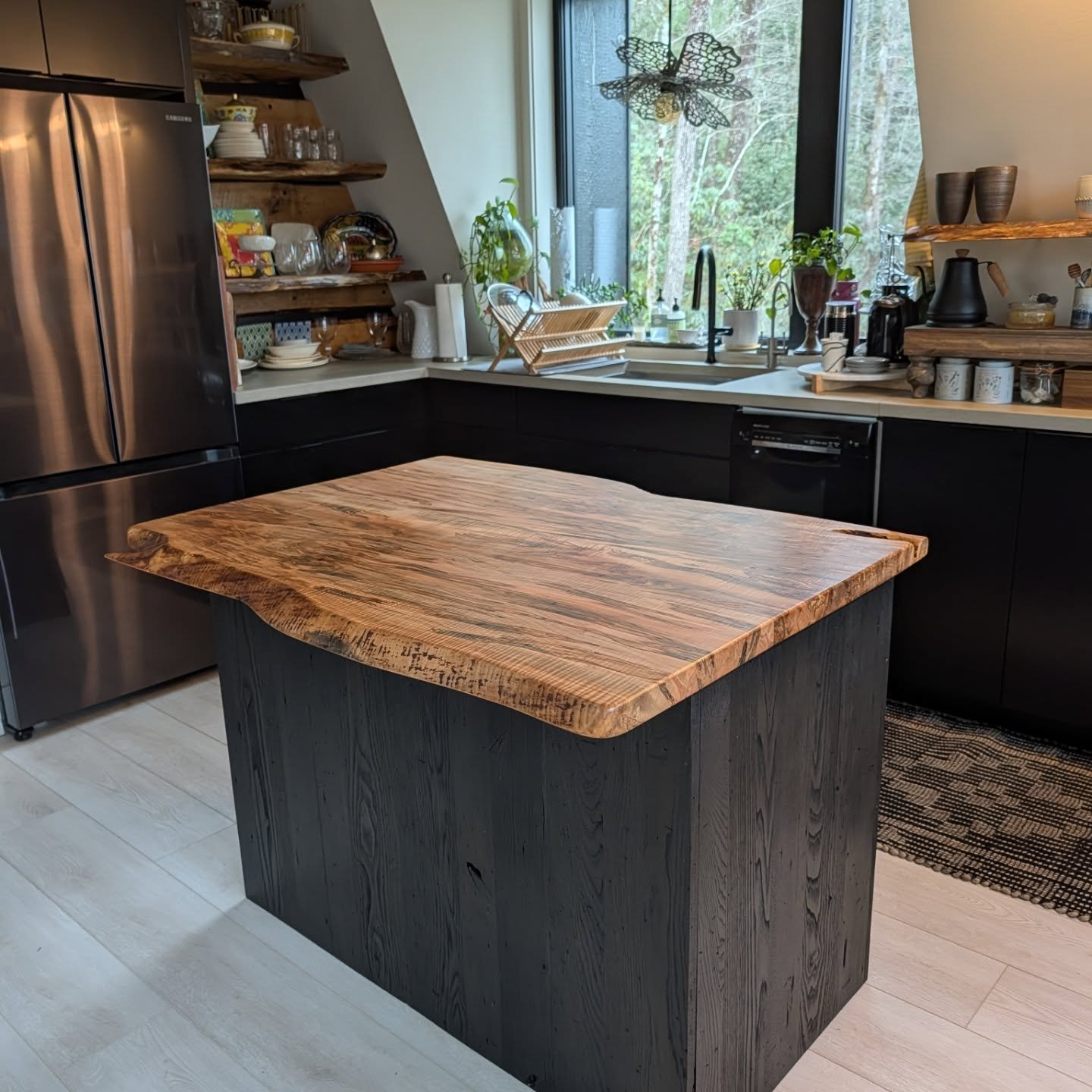 We just delivered this one-of-a-kind natural edge curly ambrosia maple island on blackened wormy chestnut cabinet and with pull out shelves to a happy client in Glen Cannon.
This top has the most unusual designs- squiggly ambrosia 'ghosts', curl, col