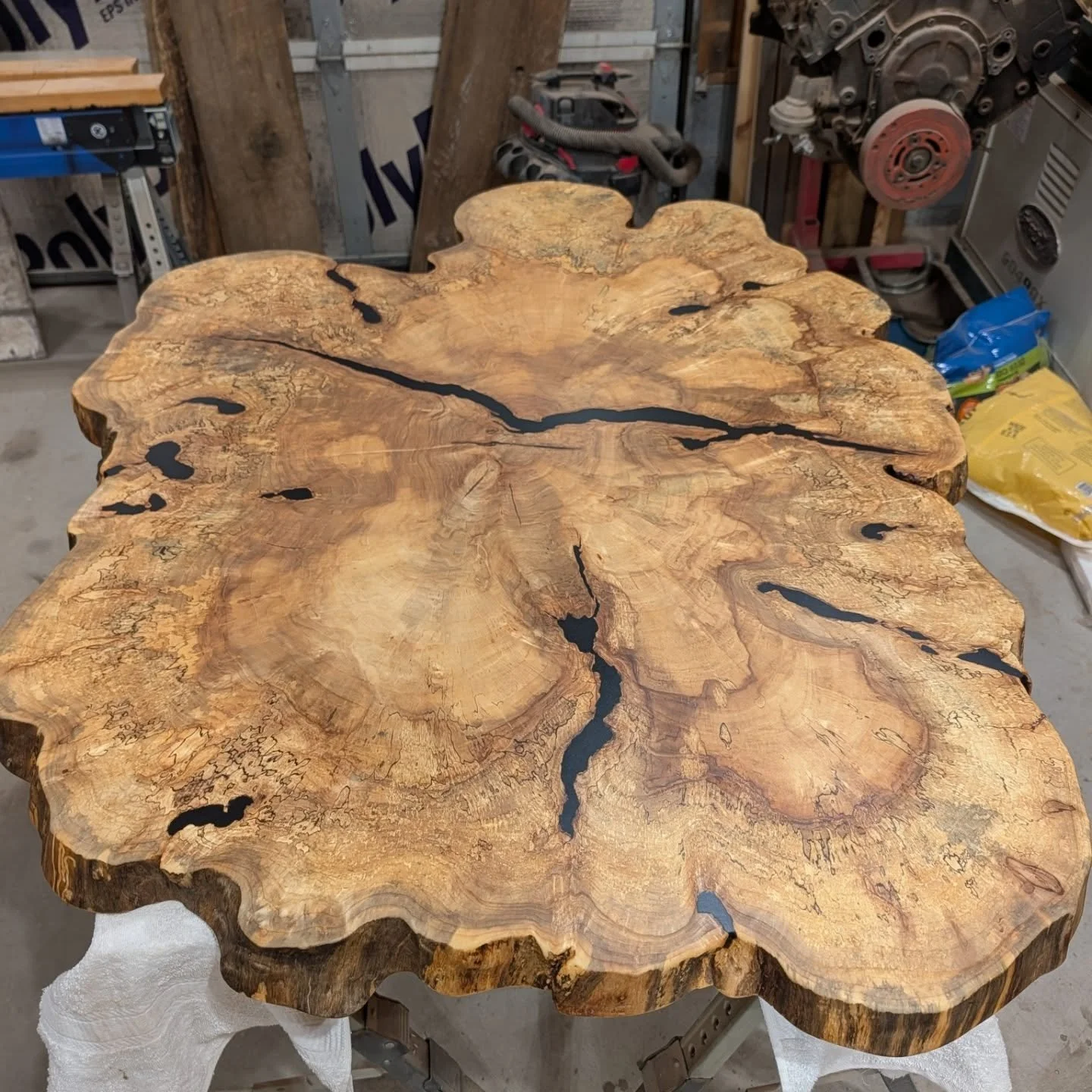 What's happening  in the shop this week? 2 custom projects are coming along great. 
A massive natural edge maple slice coffee table with black epoxy and a burly rustic waterfall desk.

Both of these are claimed but reach out to commission your own on