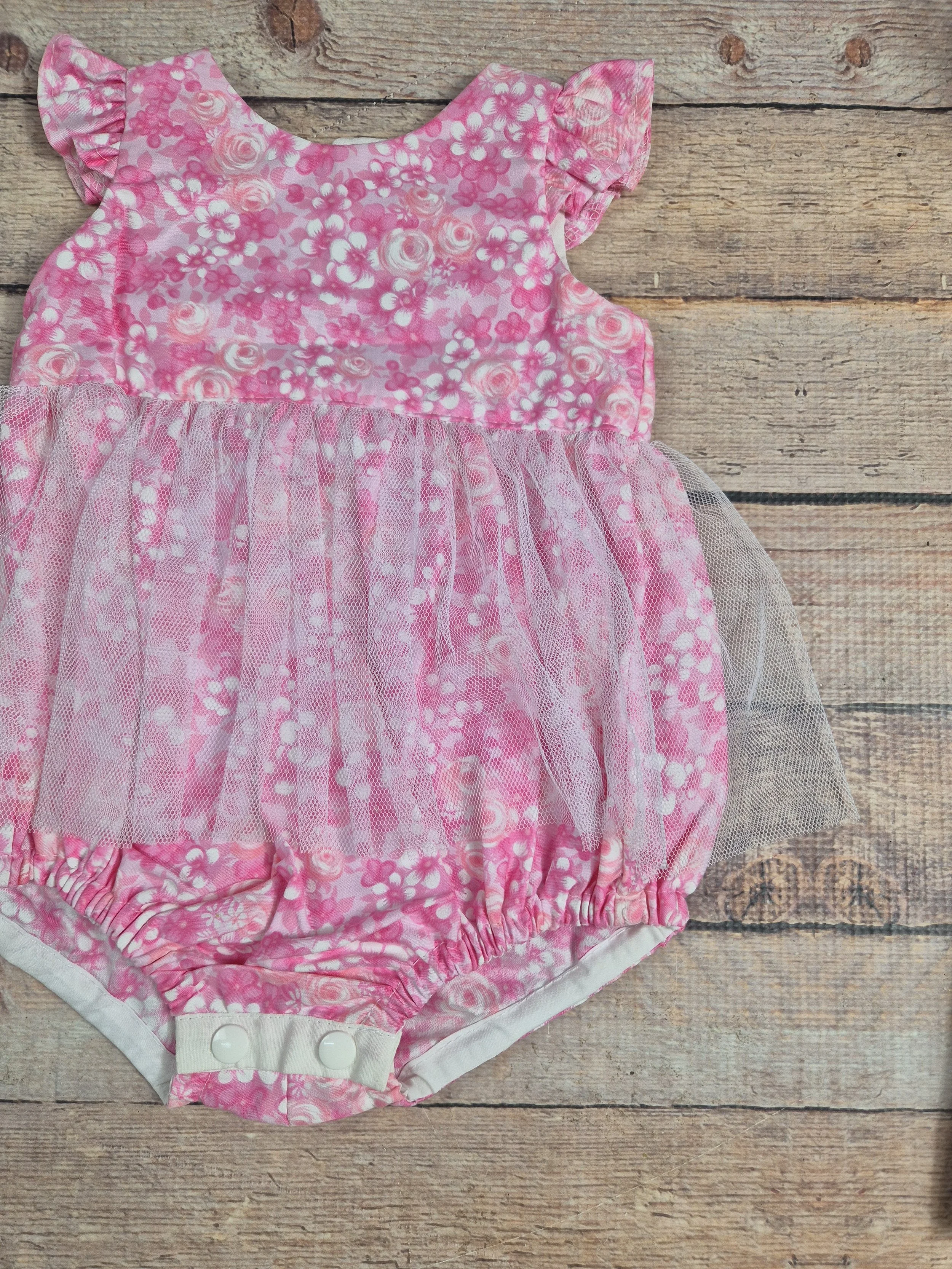 Size 00 Floral flutter sleeve and romper.