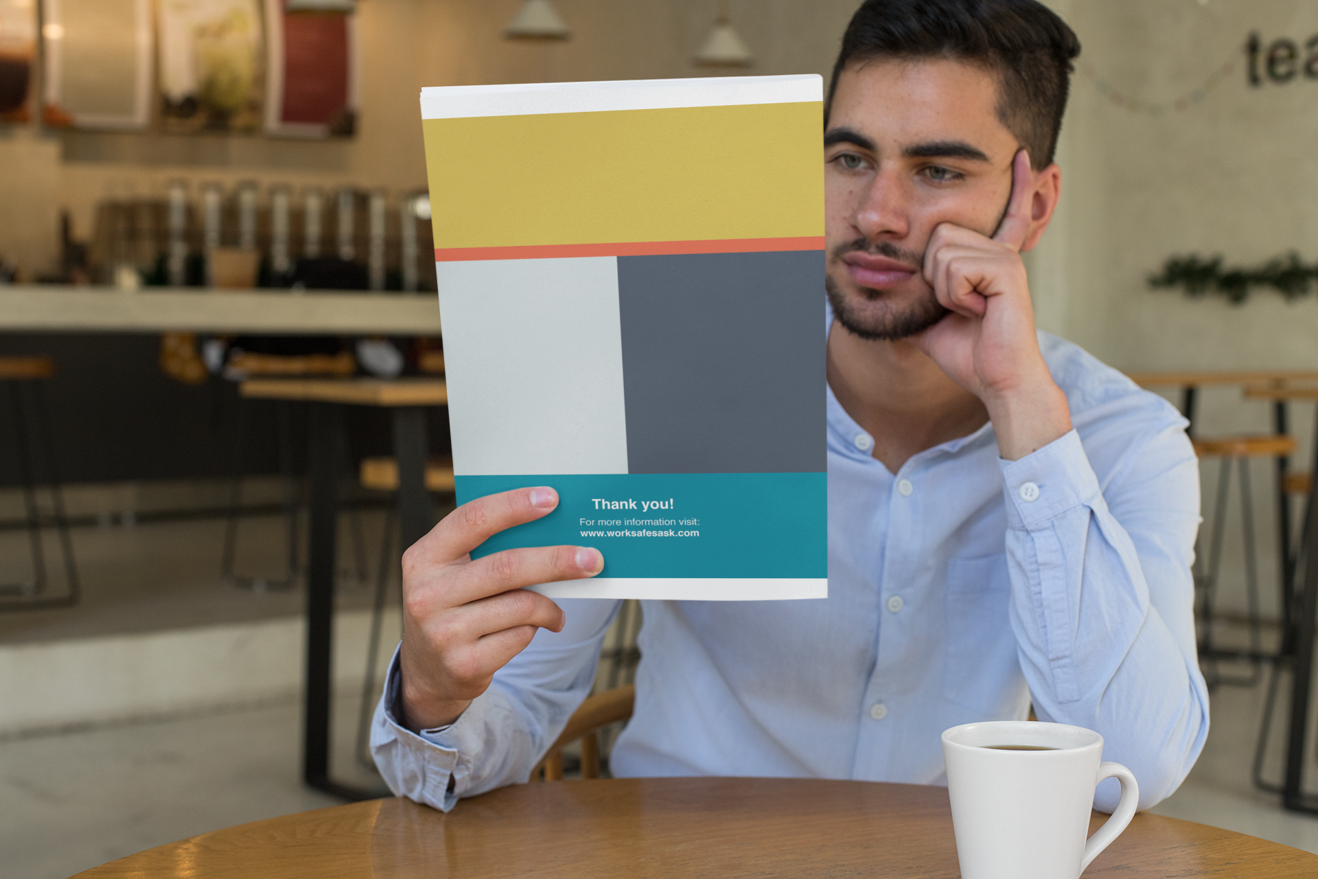 mockup-of-a-man-reading-a-magazine-at-a-coffee-shop-31548.png
