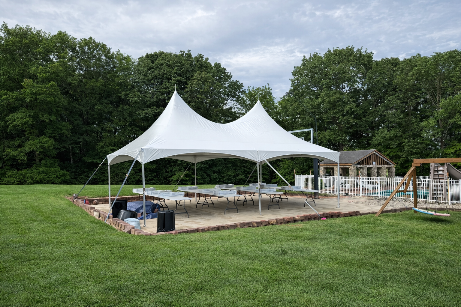 20x30 tent graduation party layout with tables and food setup