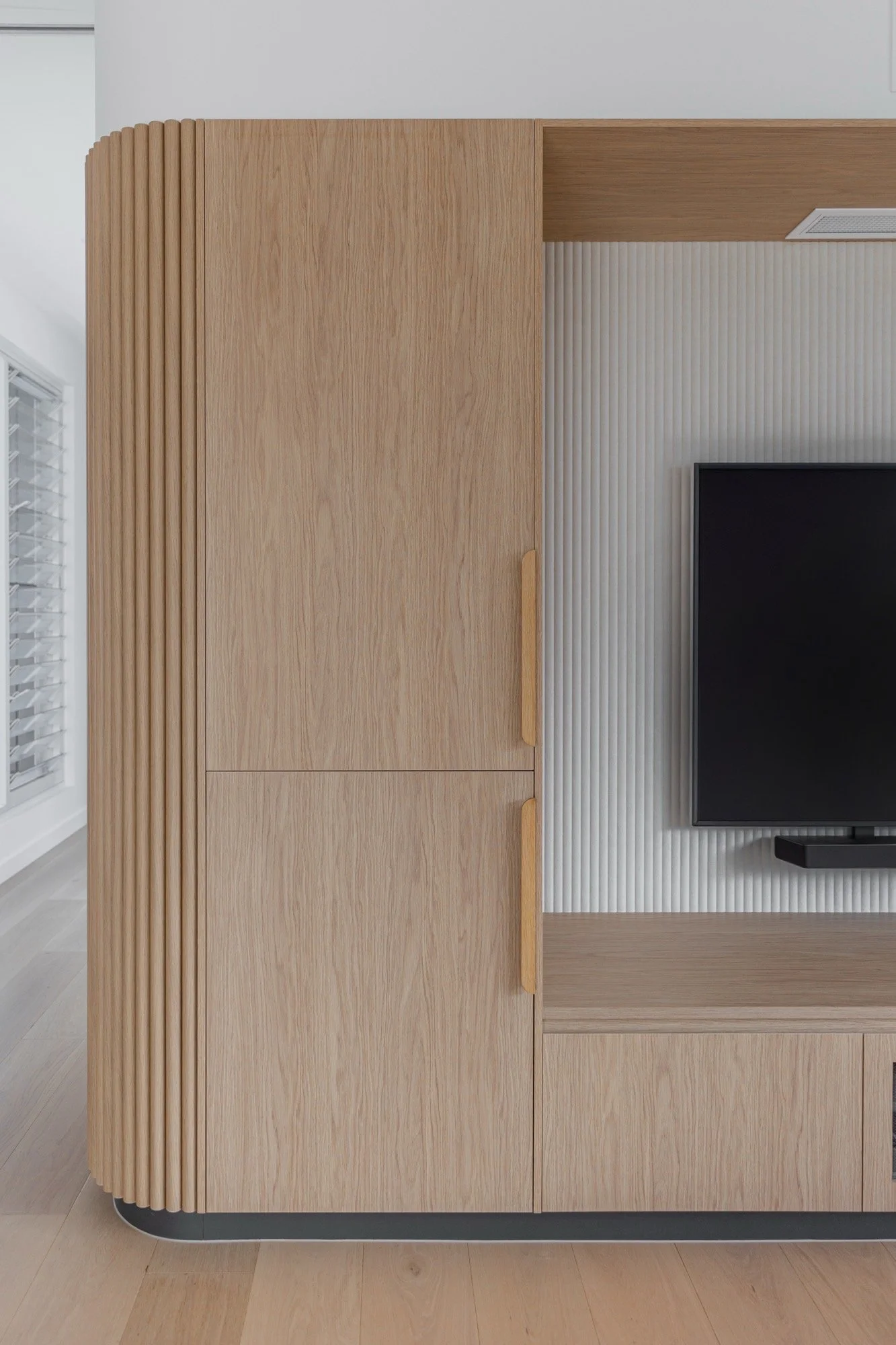 Hidden joinery compartments for entertainment spaces of the Camp Hill home 'The Concrete Canvas' by Brisbane interior designer Melinda Fritz