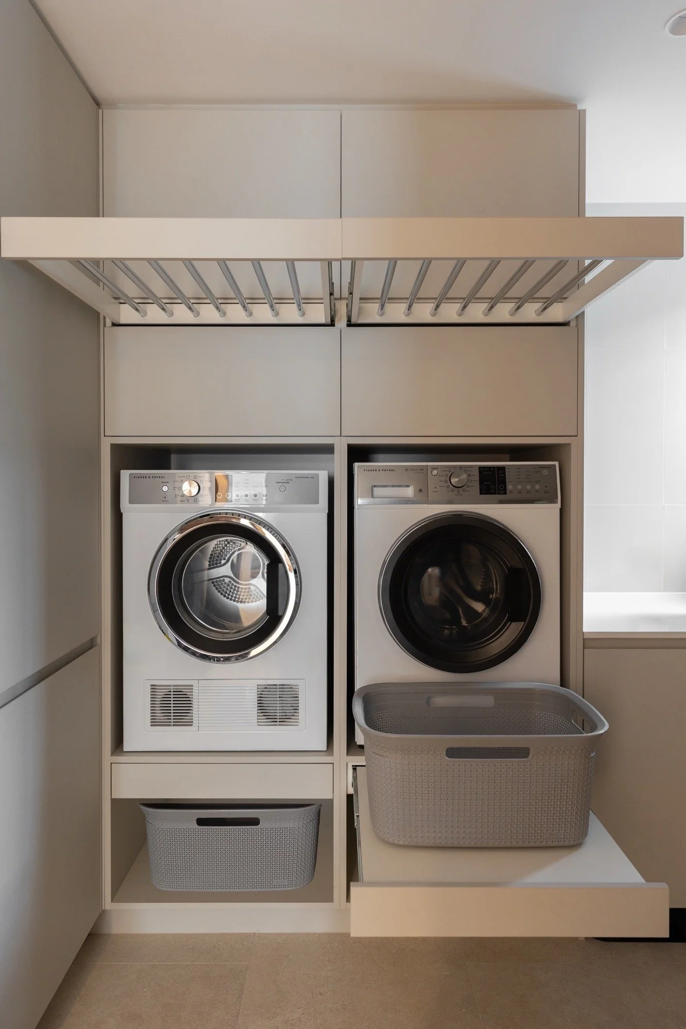 Maximising space in this custom laundry joinery for washer and dryer in the Camp Hill home 'The Concrete Canvas' by Brisbane interior designer Melinda Fritz