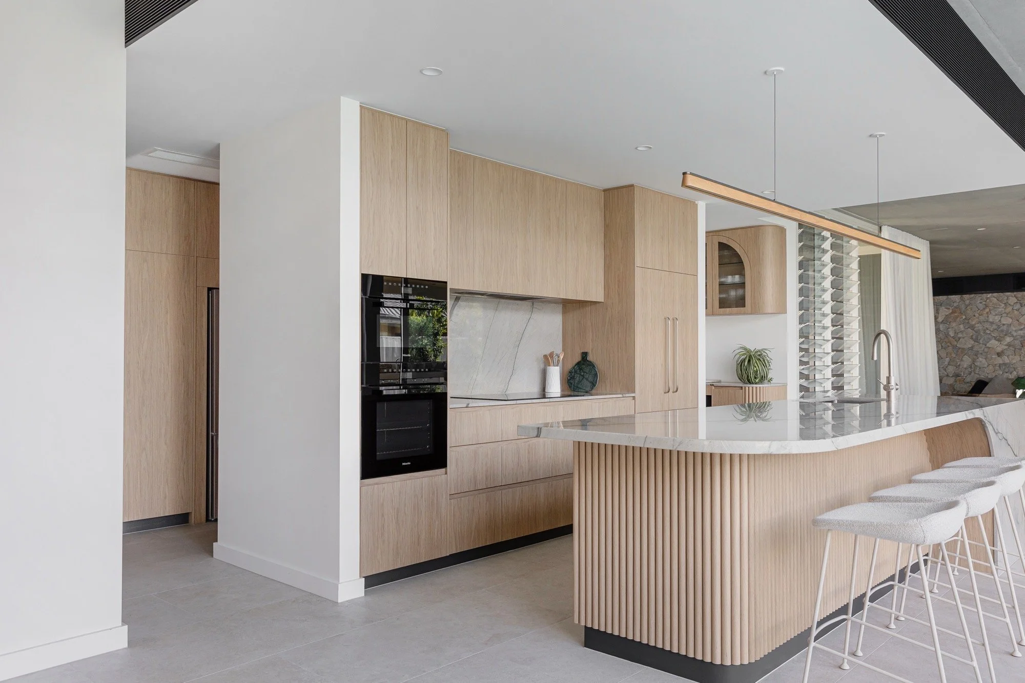 Kitchen with wrap around butlers pantry of the Camp Hill home 'The Concrete Canvas' by Brisbane interior designer Melinda Fritz