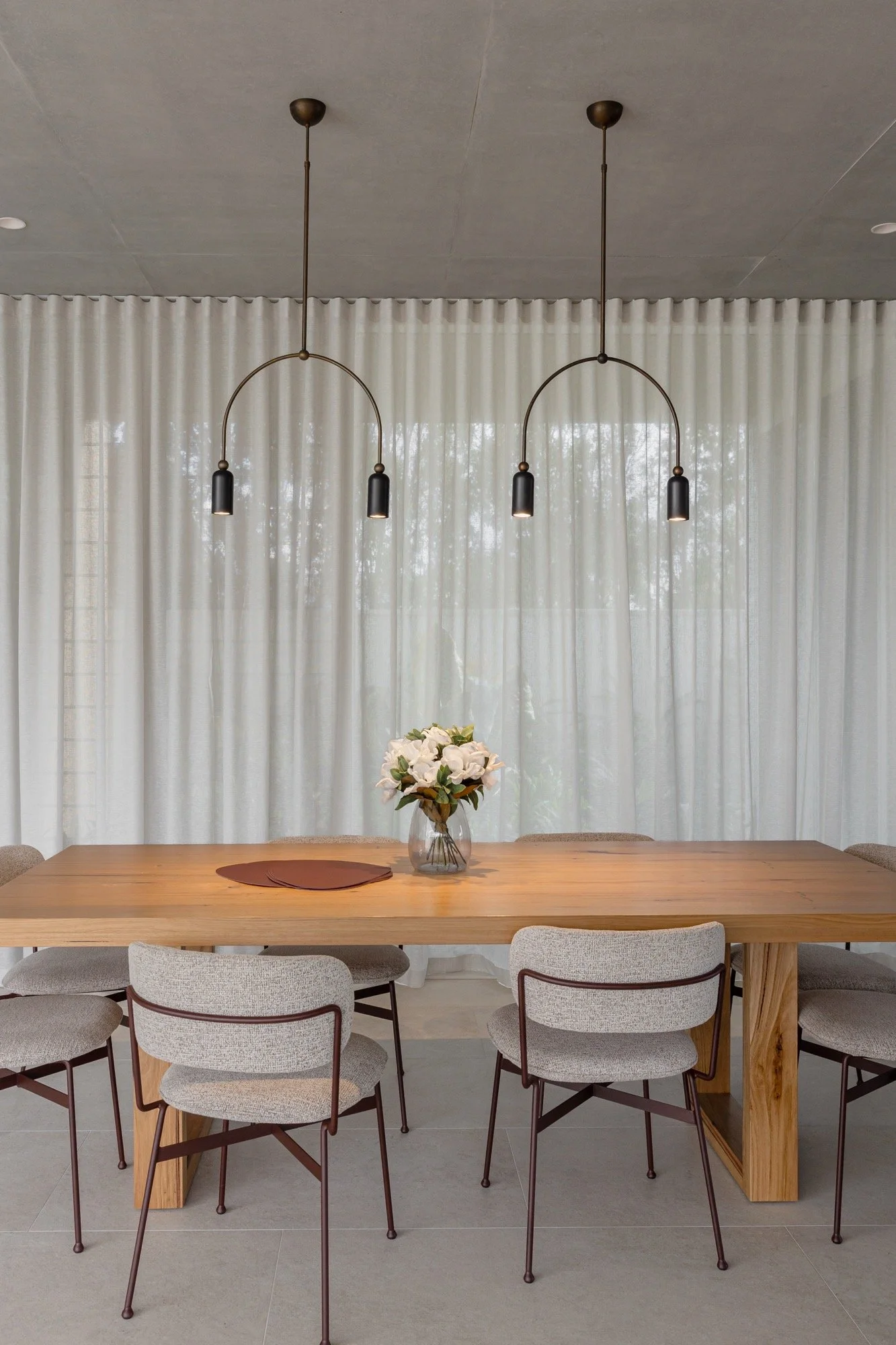 Warm and inviting dining space of the Camp Hill home 'The Concrete Canvas' by Brisbane interior designer Melinda Fritz