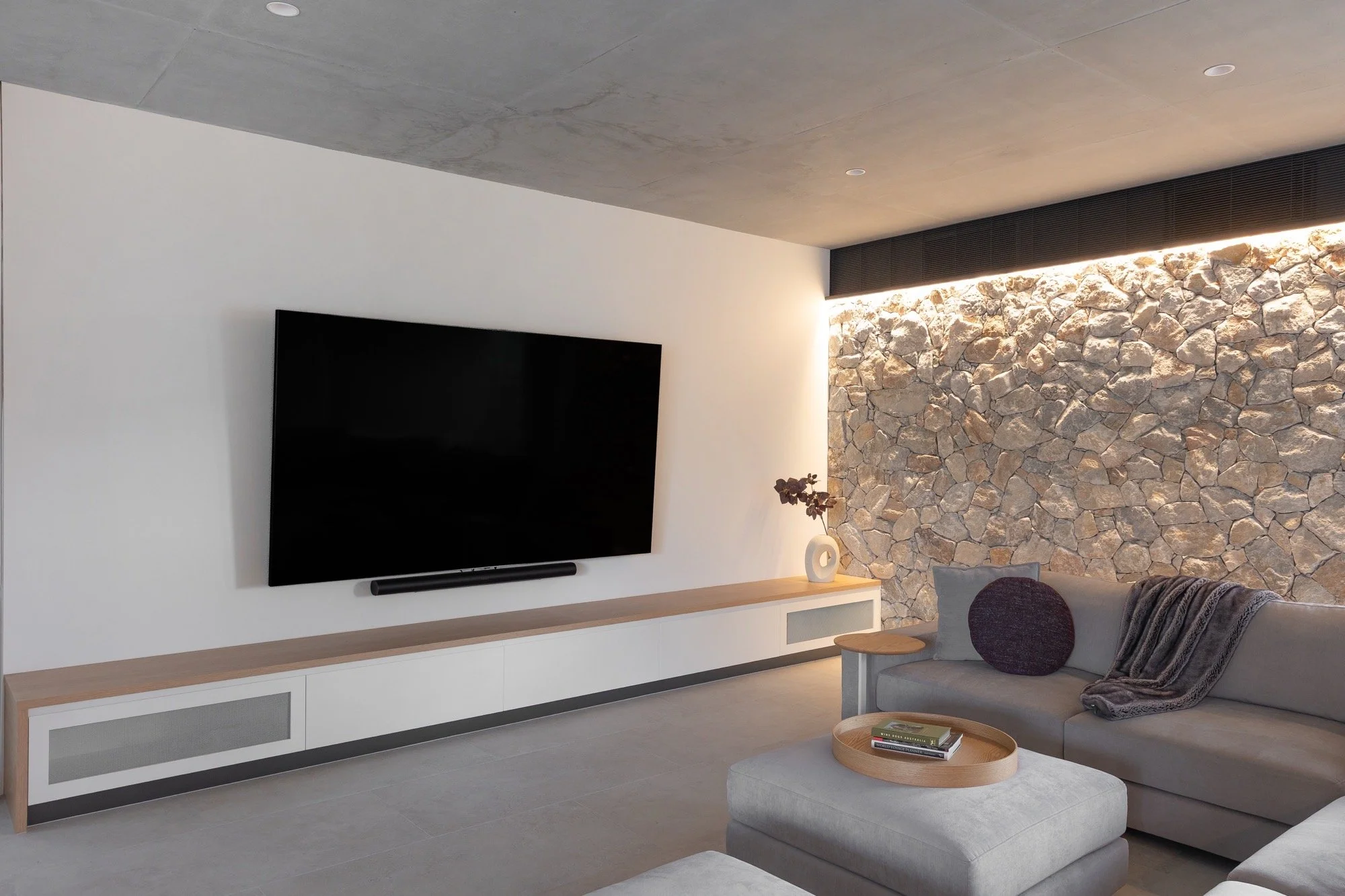 Textured living and entertainment space of the Camp Hill home 'The Concrete Canvas' by Brisbane interior designer Melinda Fritz