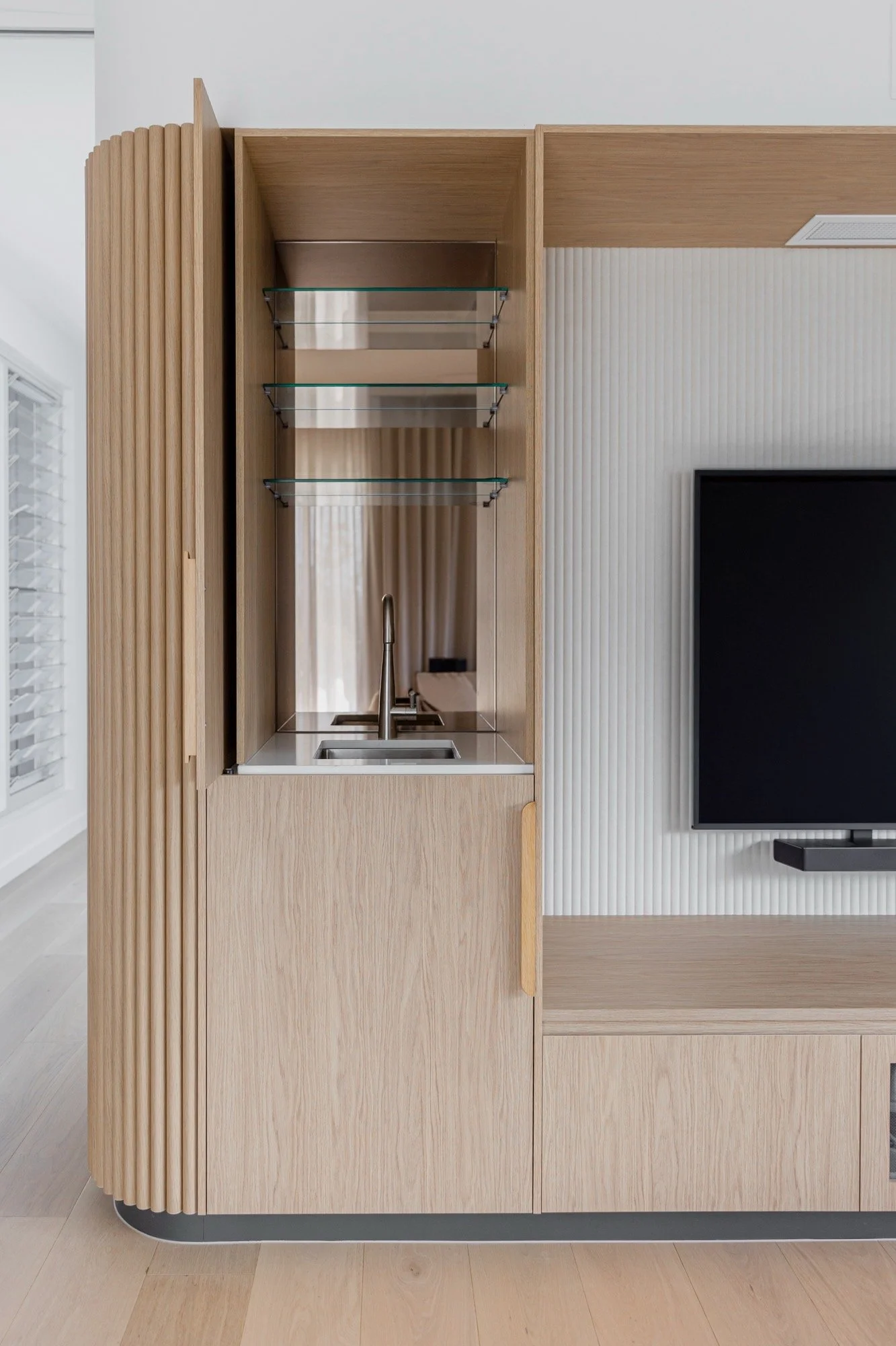Clever custom bar joinery integrations in entertainment areas of the Camp Hill home 'The Concrete Canvas' by Brisbane interior designer Melinda Fritz