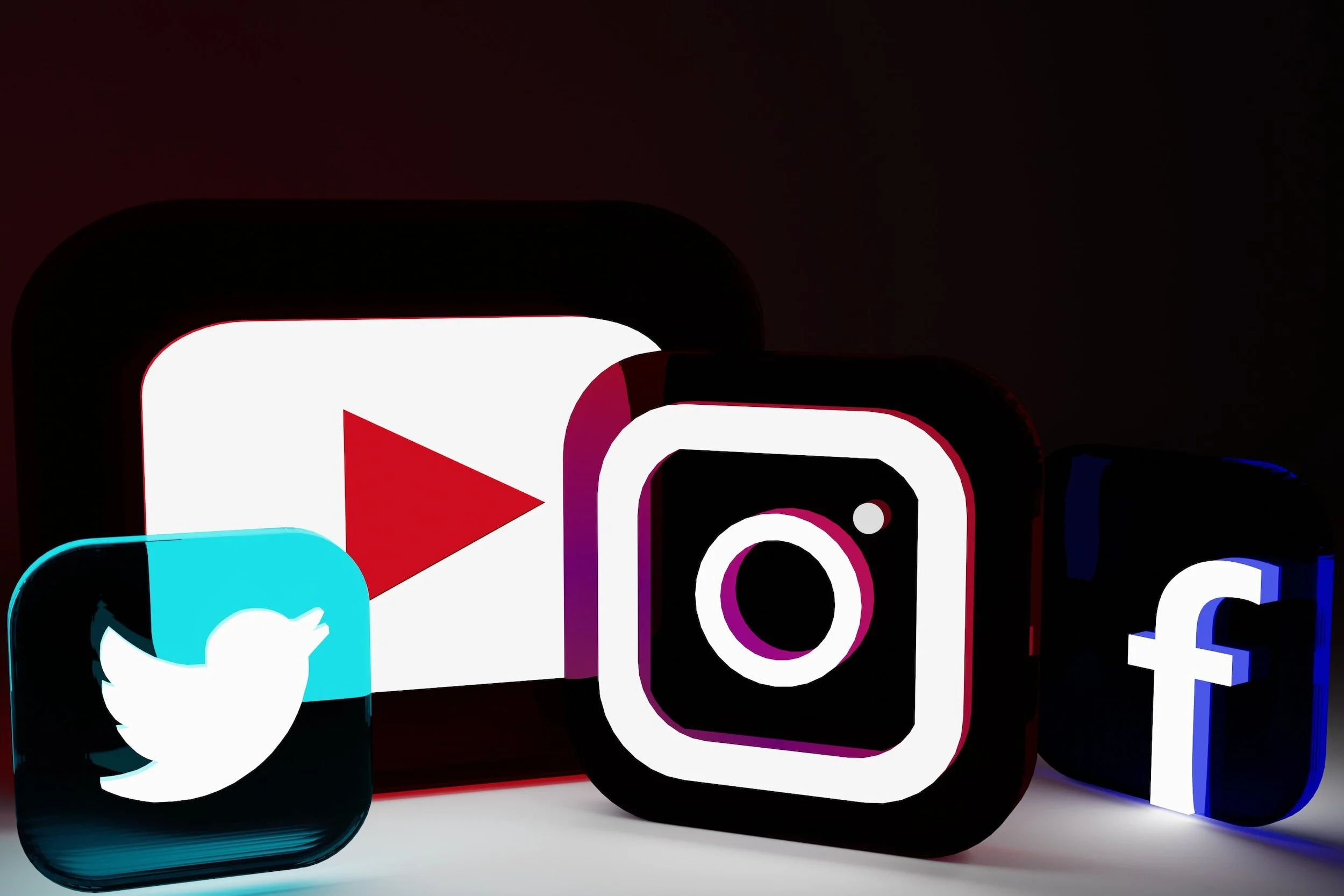 Neon icons of social media platforms including YouTube, Instagram, Twitter, and Facebook displayed in a row.
