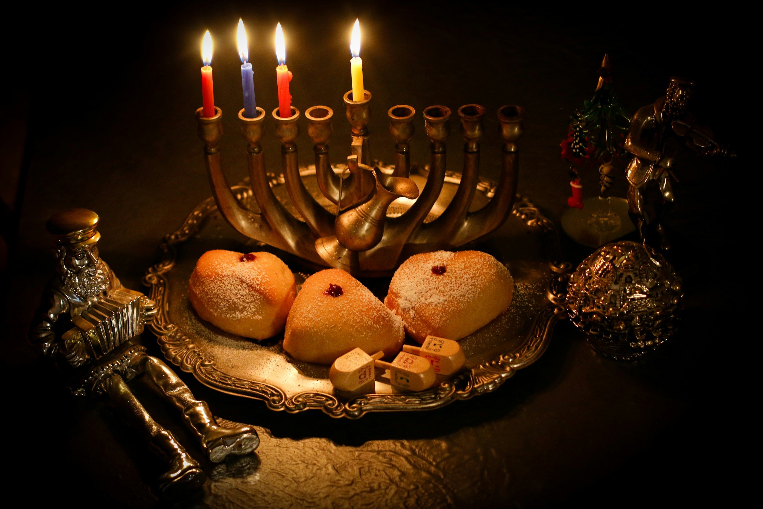 Hanukkah candles, donuts, and dreidels to celebrate the season