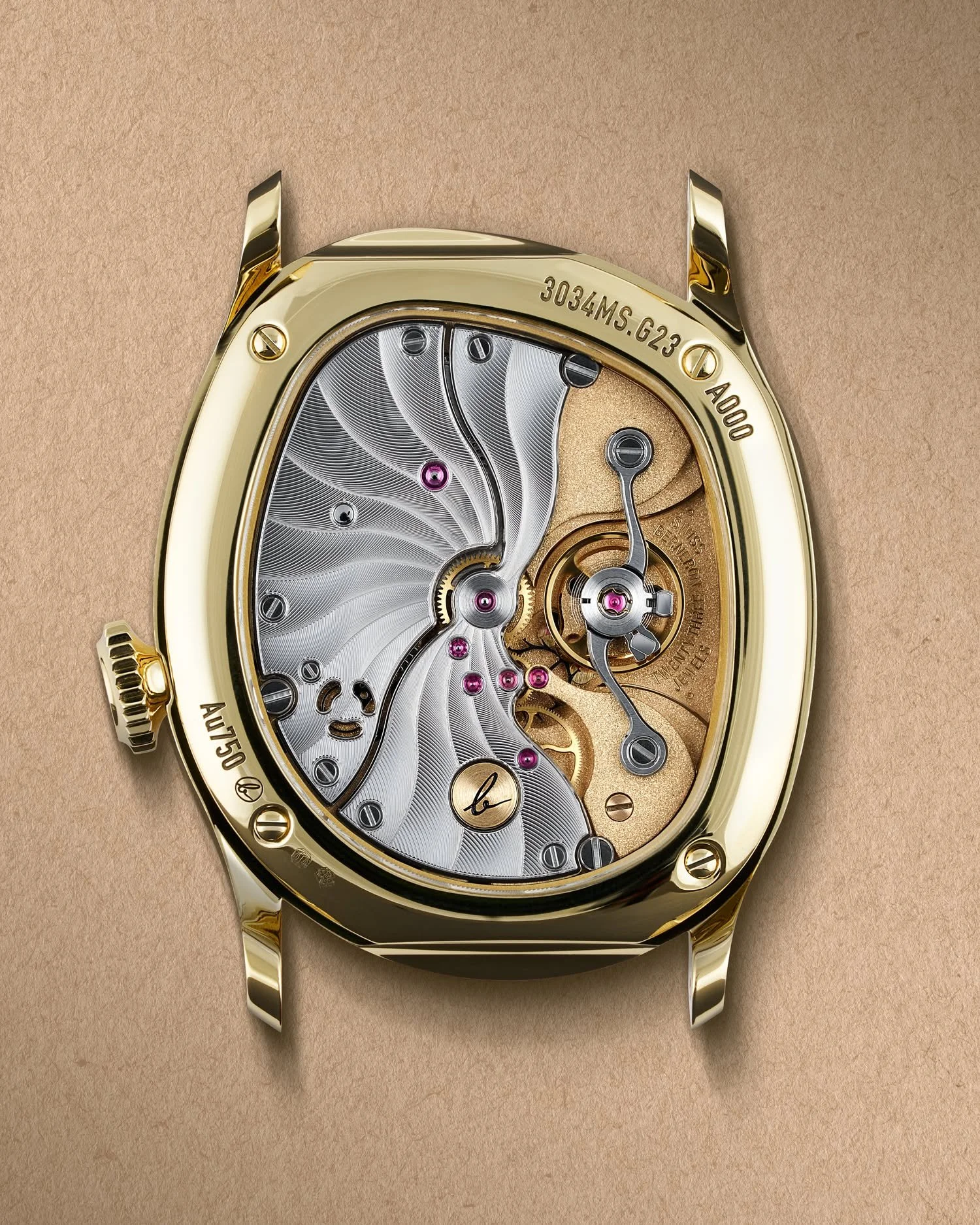 &bull; Mirage 34 &bull; Caliber 215
Working with different shades of gold allows us to visually separate certain sub-assemblies and create more depth in the overall composition. 
With a total thickness of 2.15mm, the Mirage 34 caliber cannot rely on 