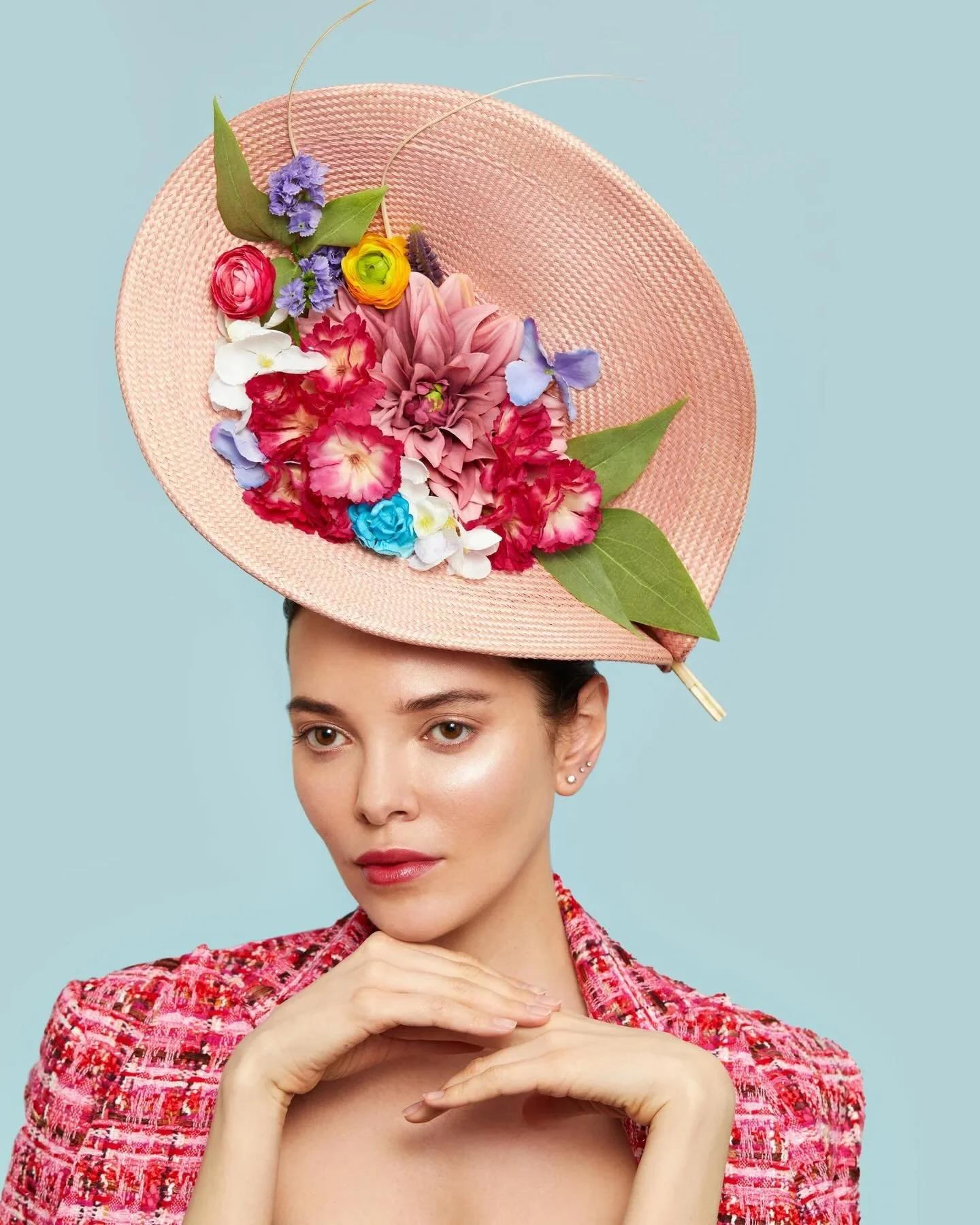 Ascot In Bloom - This is more of a sculptural Royal Ascot style hat that been adorned with silk flowers. 
This hat can be created in any colour except blue and is perfect for #Royalascot 
All of our hats are handmade in the london studio.
We also spe