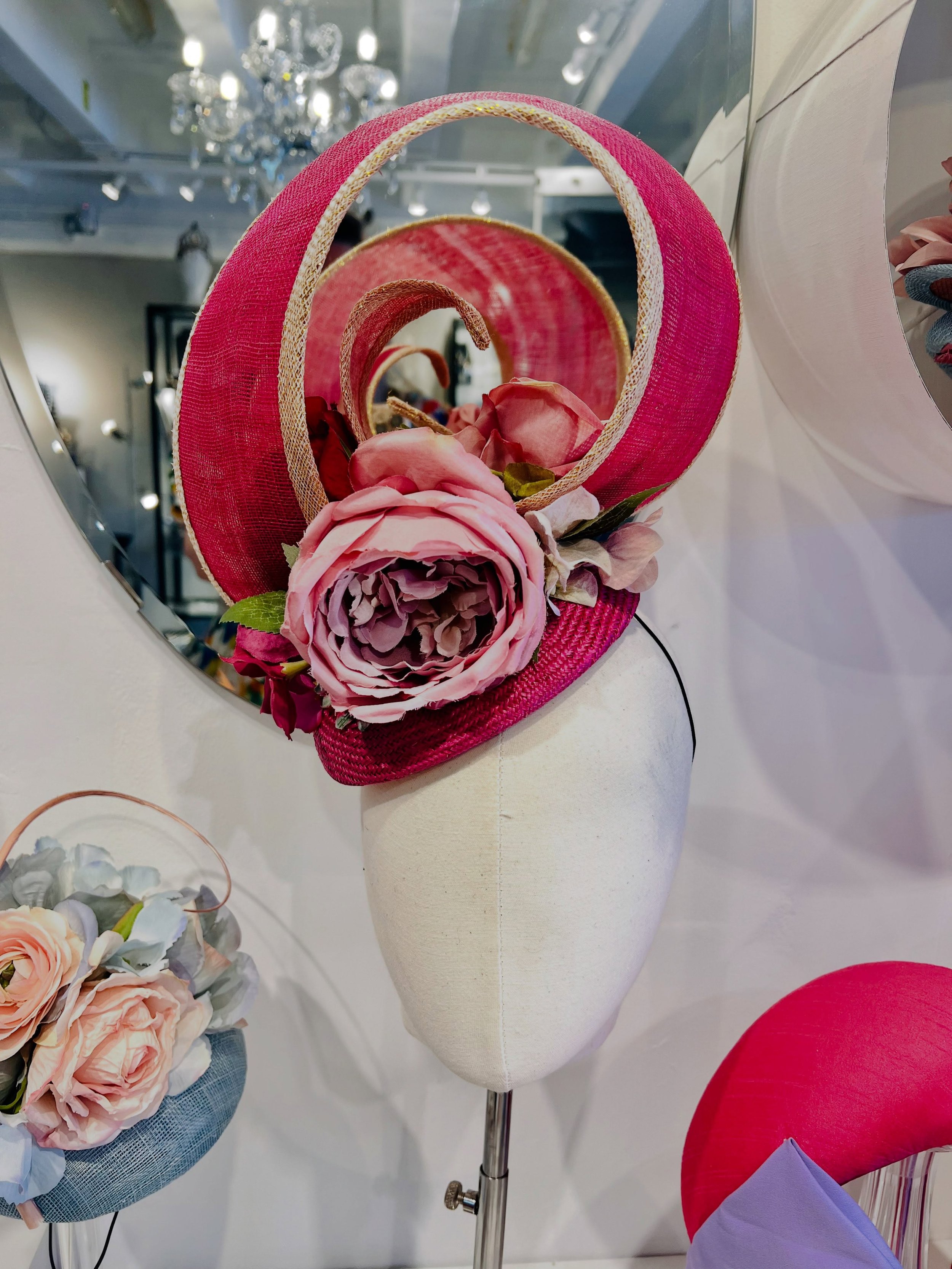 I want to show you this piece before it leaves my shop at the end of the week, where it is destined for Royal Ascot. 
A beautiful fuchsia Sinamay sculptural headpiece with gold edging and silk flowers; a pink peony is placed at the front, along with 