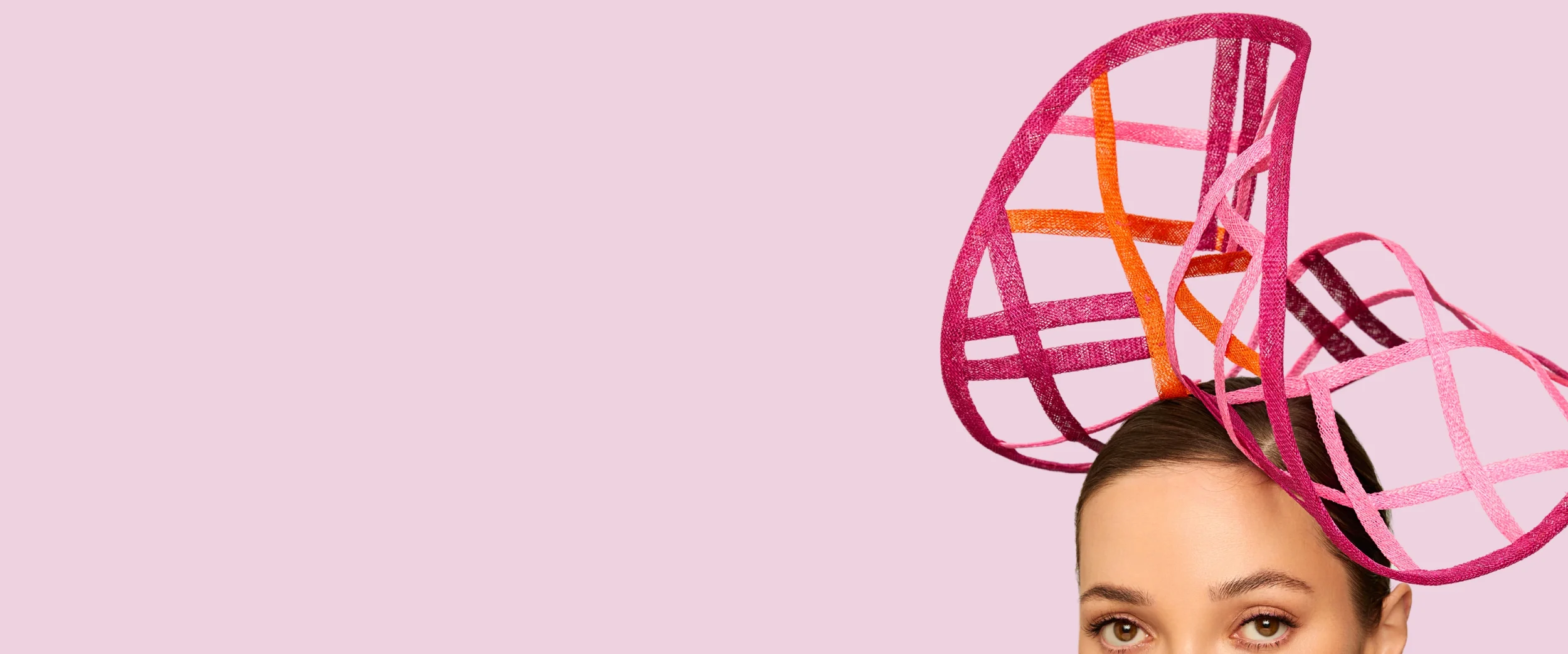 Spring summer 2026 collection pink background and women i bright lattice hat at front