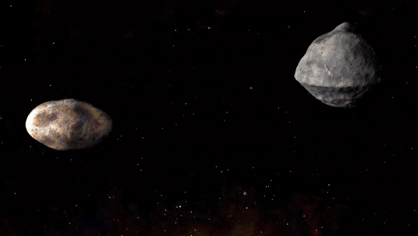 Ilustración del sistema binario de asteroides Didymos–Dimorphos. La pequeña luna Dimorphos fue el objetivo de la misión DART, diseñada para comprobar si un impacto cinético puede desviar la trayectoria de un asteroide.