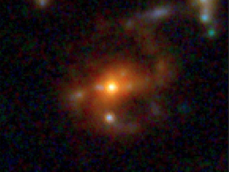 Imagen compuesta en falso color de la galaxia M1149-BSG-z5. En ella se distinguen el brillante núcleo, la barra estelar central y los incipientes brazos espirales.