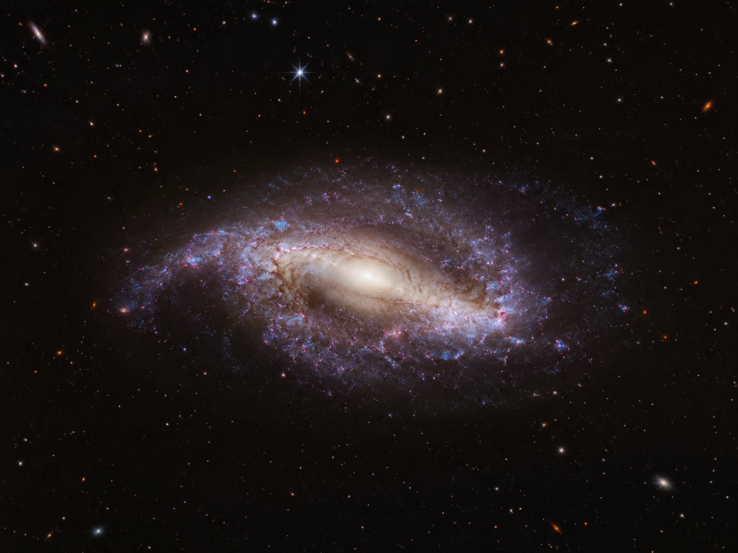 Recreación artística de la galaxia M1149-BSG-z5, la espiral barrada más antigua conocida, observada por el telescopio espacial James Webb tal como era hace unos 12.600 millones de años, cuando el universo apenas tenía 1.200 millones de años.