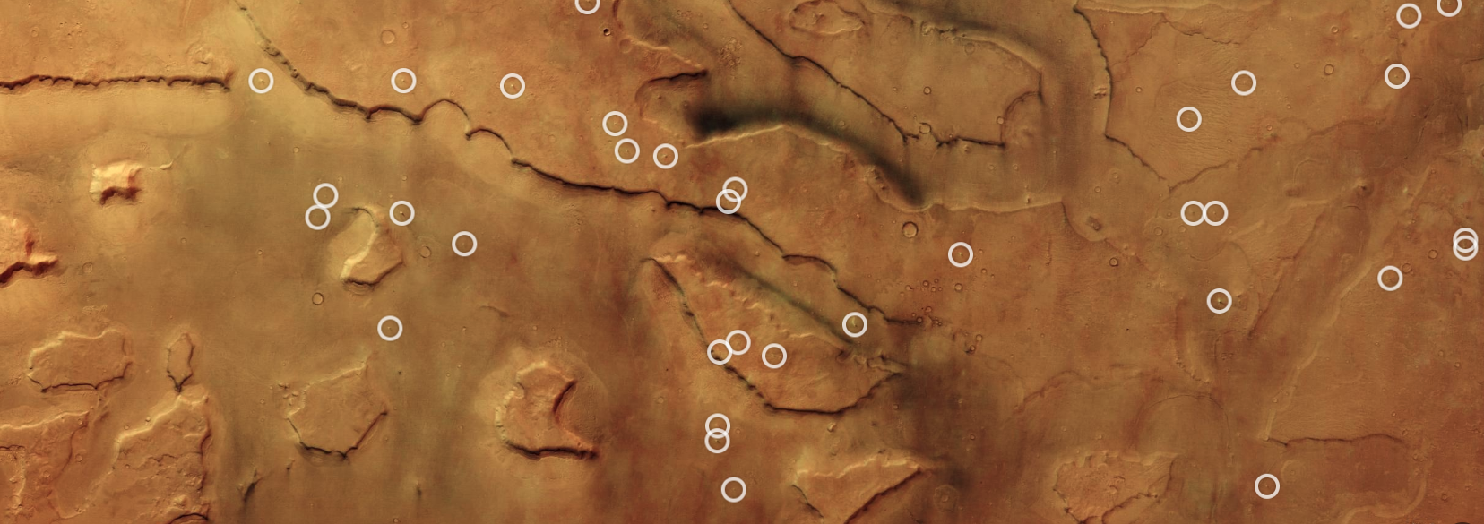 Decenas de remolinos de polvo recorren el sistema de cañones de Mamers Valles, en el hemisferio norte de Marte.