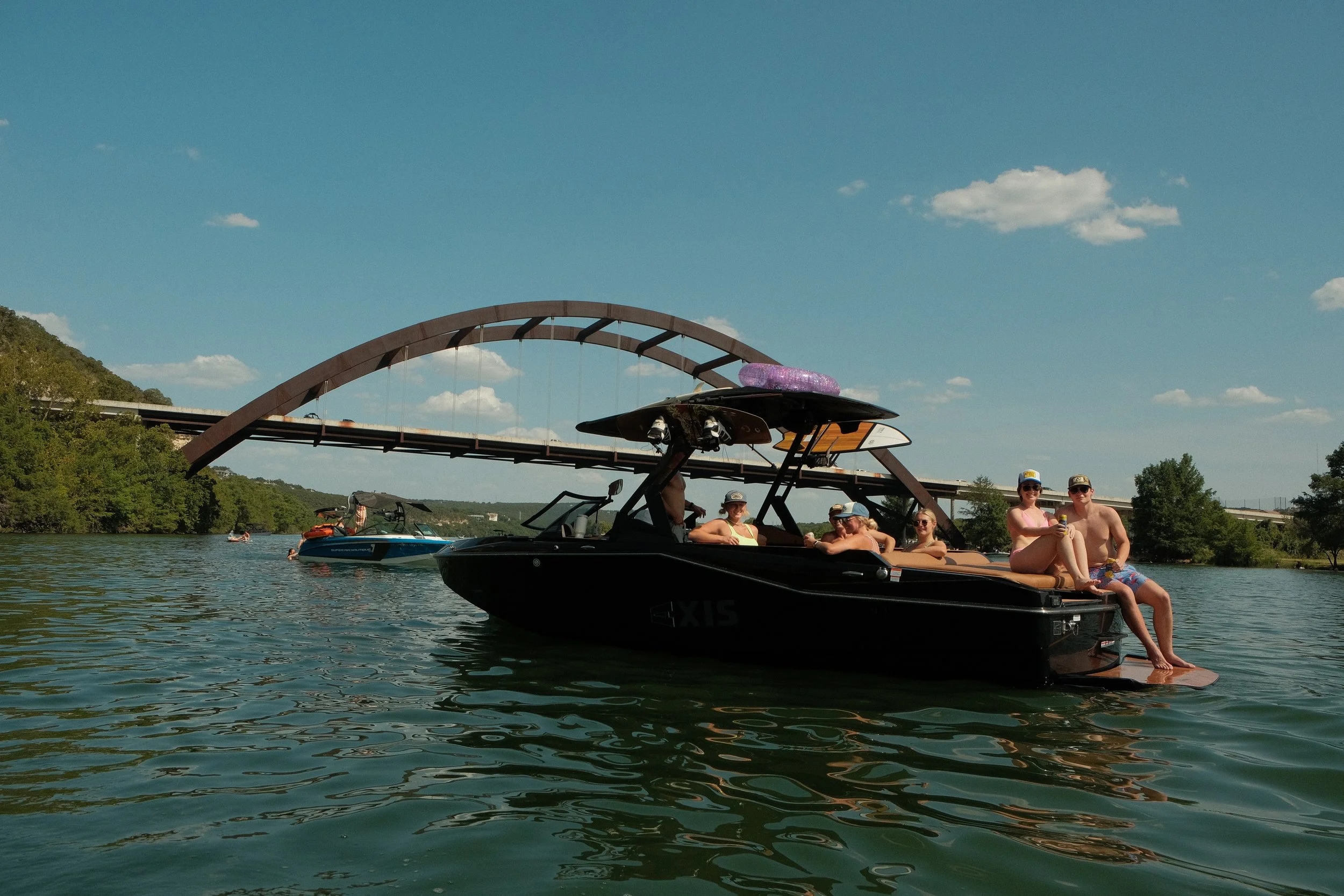 Wake surf boat available for charter on Lake Austin