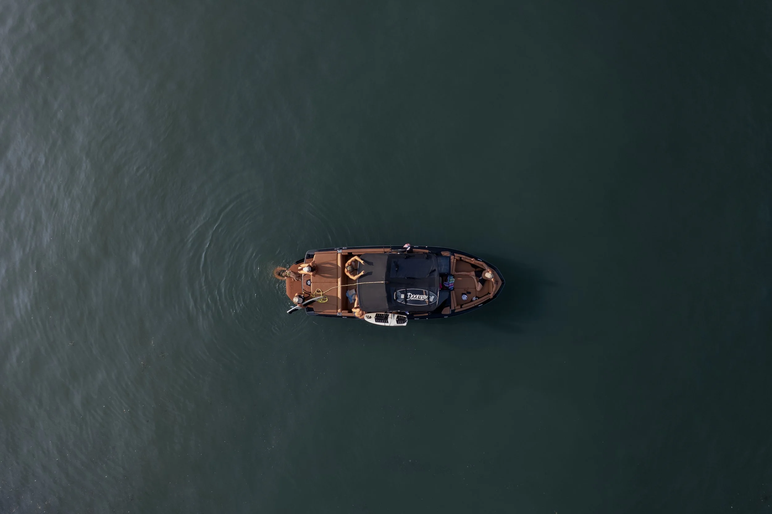 Wake surf boat available for charter on Lake Austin