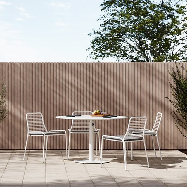 The XY Dining Set is minimal, airy, and functional. The 48&rdquo; round table is the ideal size for shared meals and meetings. Stackable chairs feature a removable cushion made with quick-dry foam and Sunbrella&reg; fabric. Table base also acts as a 