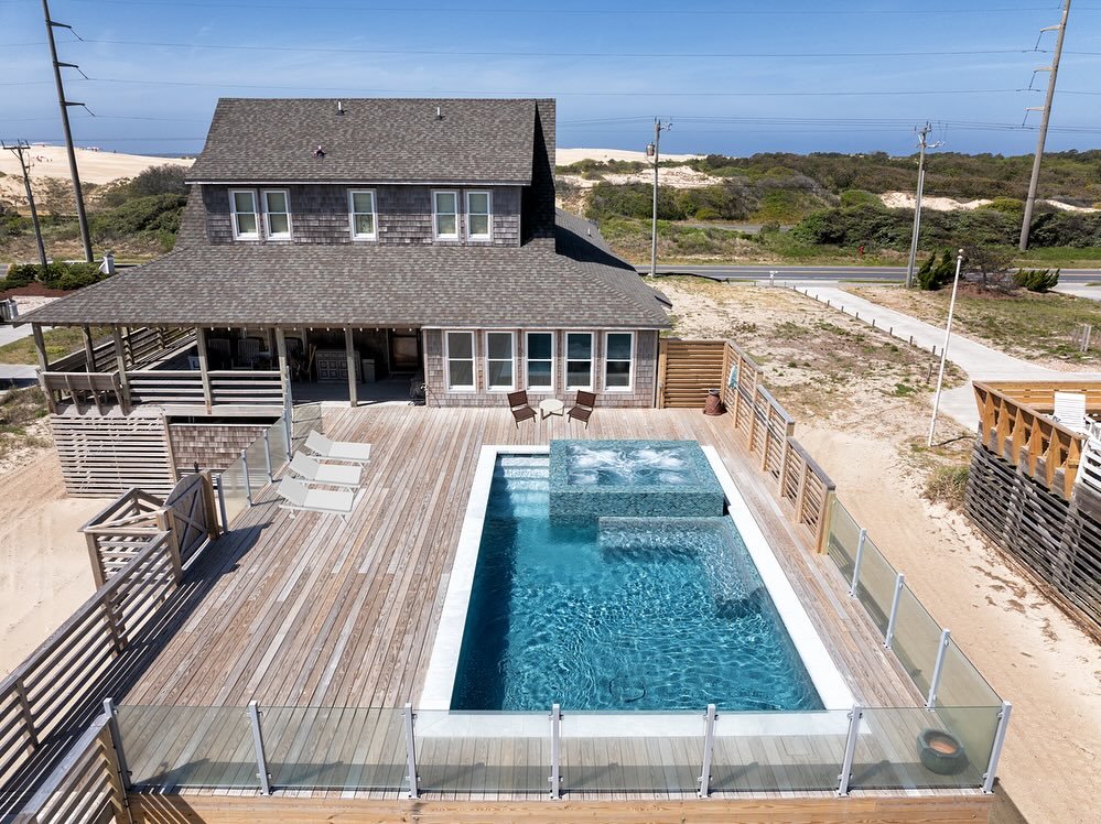 A look at our recent project in Historic Beach Cottage Row in Nags Head. Building this pool to second floor level to allow views of the ocean required us to construct concrete piers to elevate the entire structure (slide6) due to FEMA restrictions. T