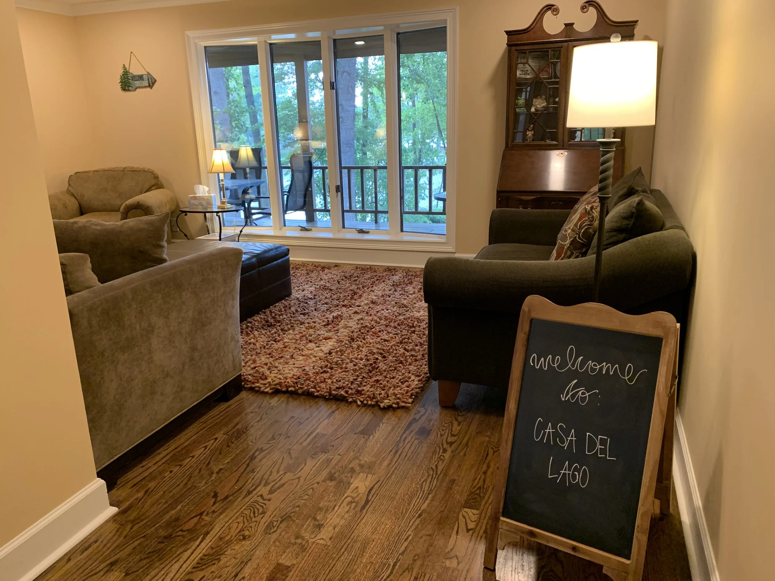 Enter through the front door for an inviting welcome to Casa del Lago and a view to the lake from the Living Room.