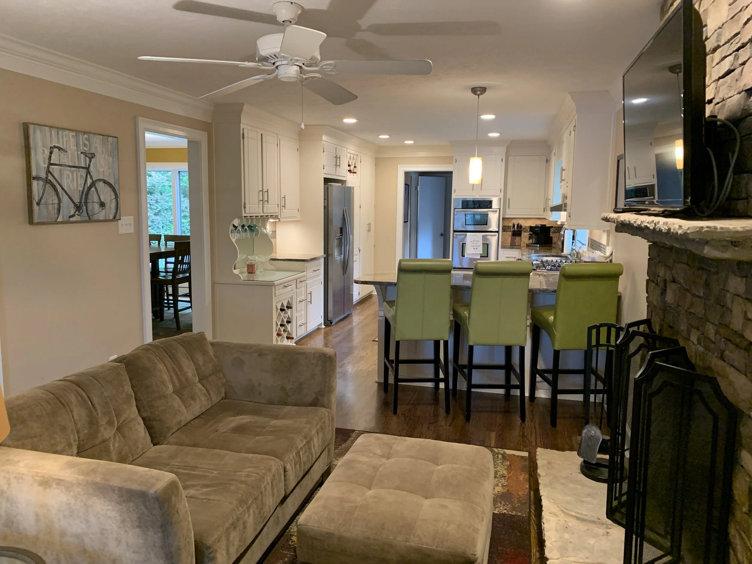 Sitting room and kitchen with adjacent dining room.