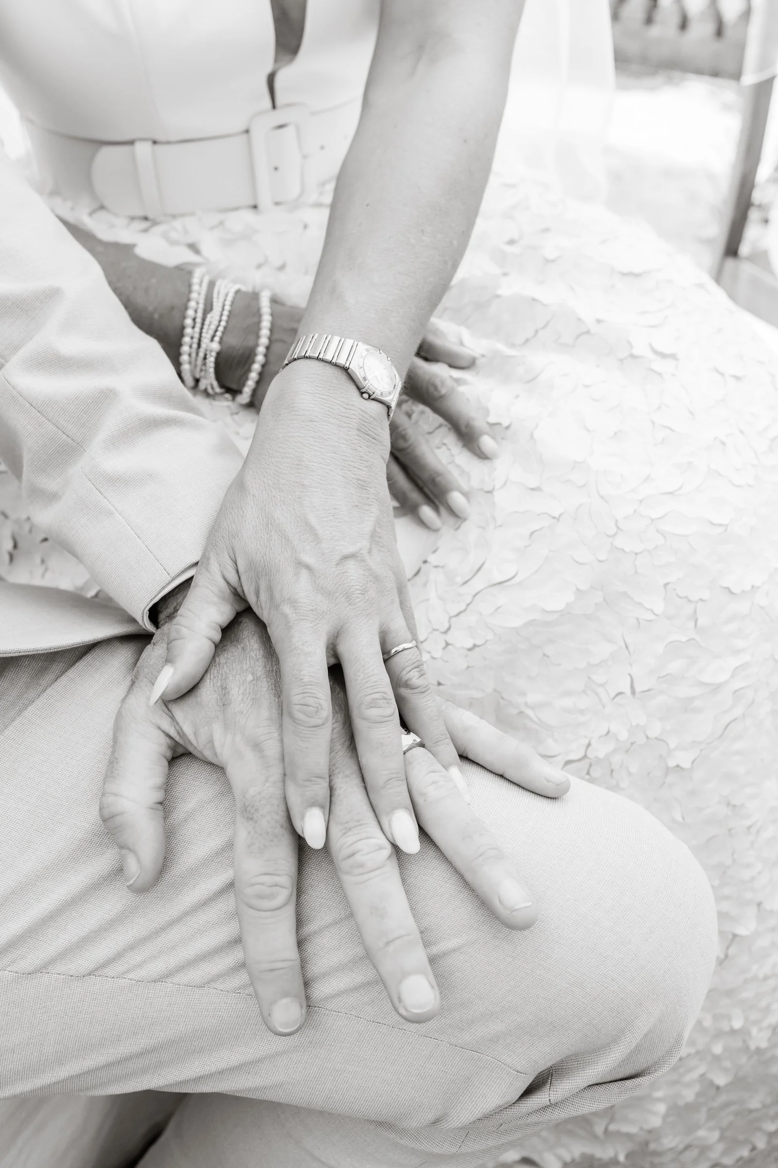 Close-up of a intimate moment to the hands with wedding rings