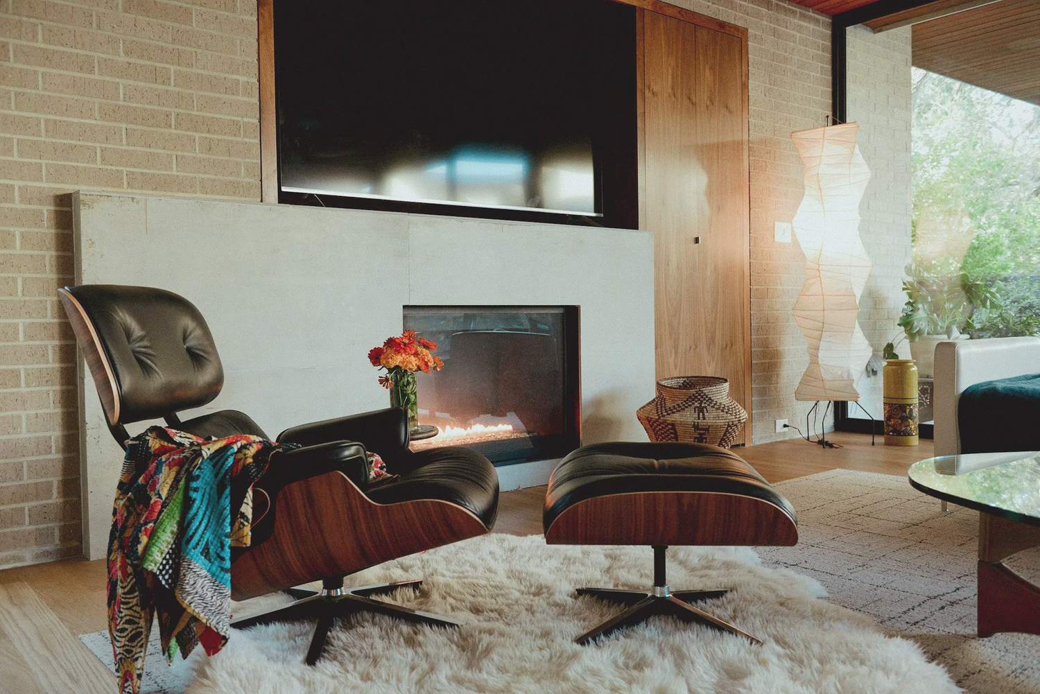 Will Jordan living room with layered furnishings and natural wood