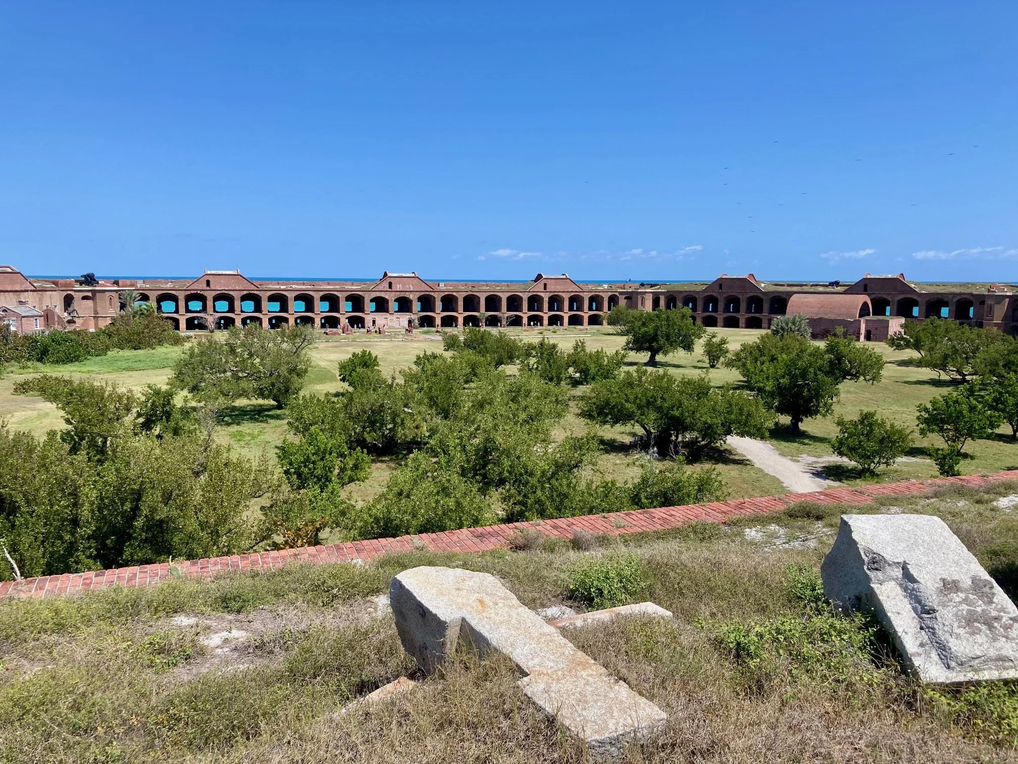 A frigate bird sails overhead. You hear only the wind. You walk the ramparts without any safety rails.