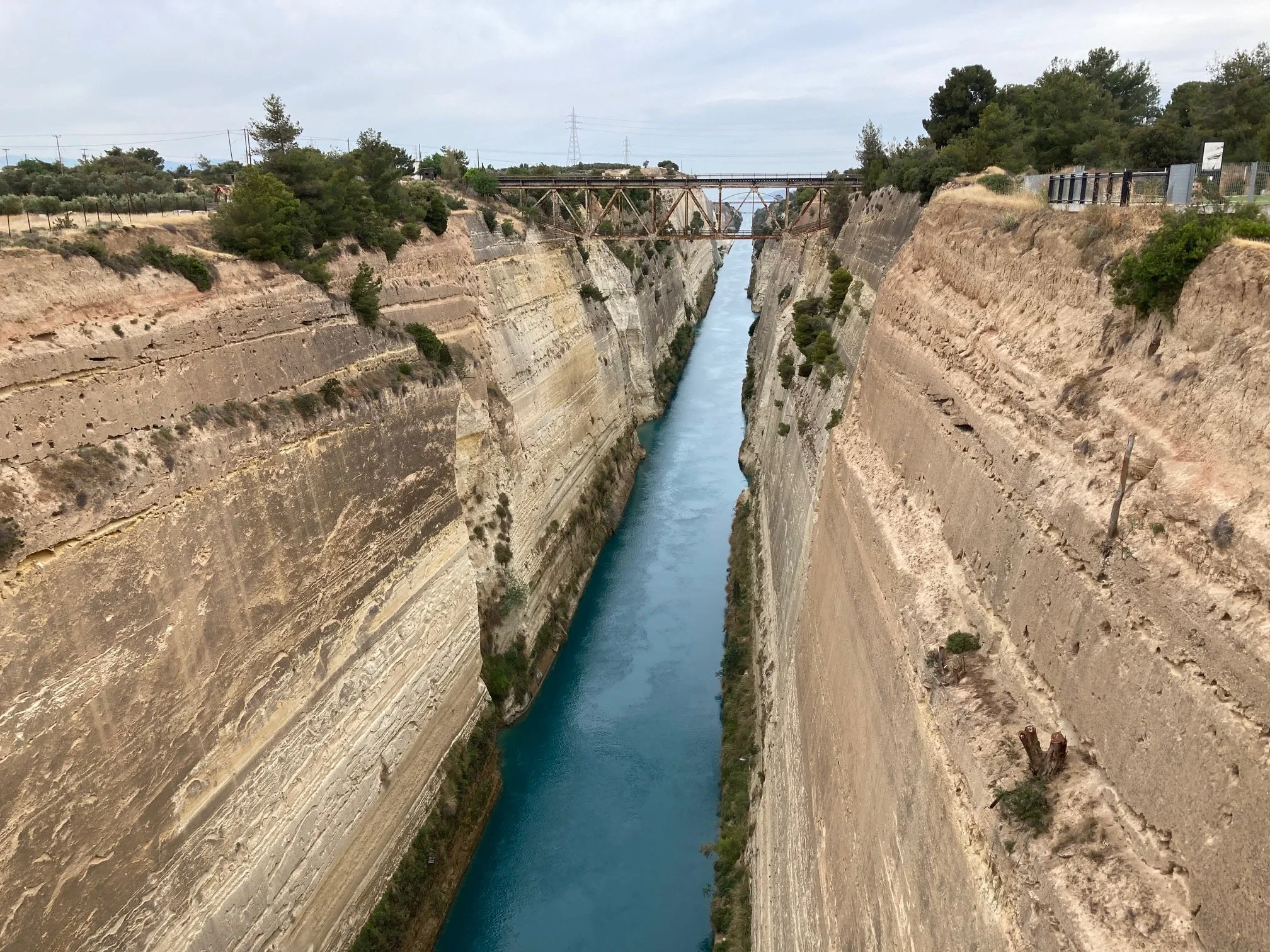 The isthmus of Corinth separates the Peloponnese from mainland Greece. On your way to the site, you cross the Corinthian Canal--attempted by the ancients, but only completed in the 1890s by the Ottomans. 