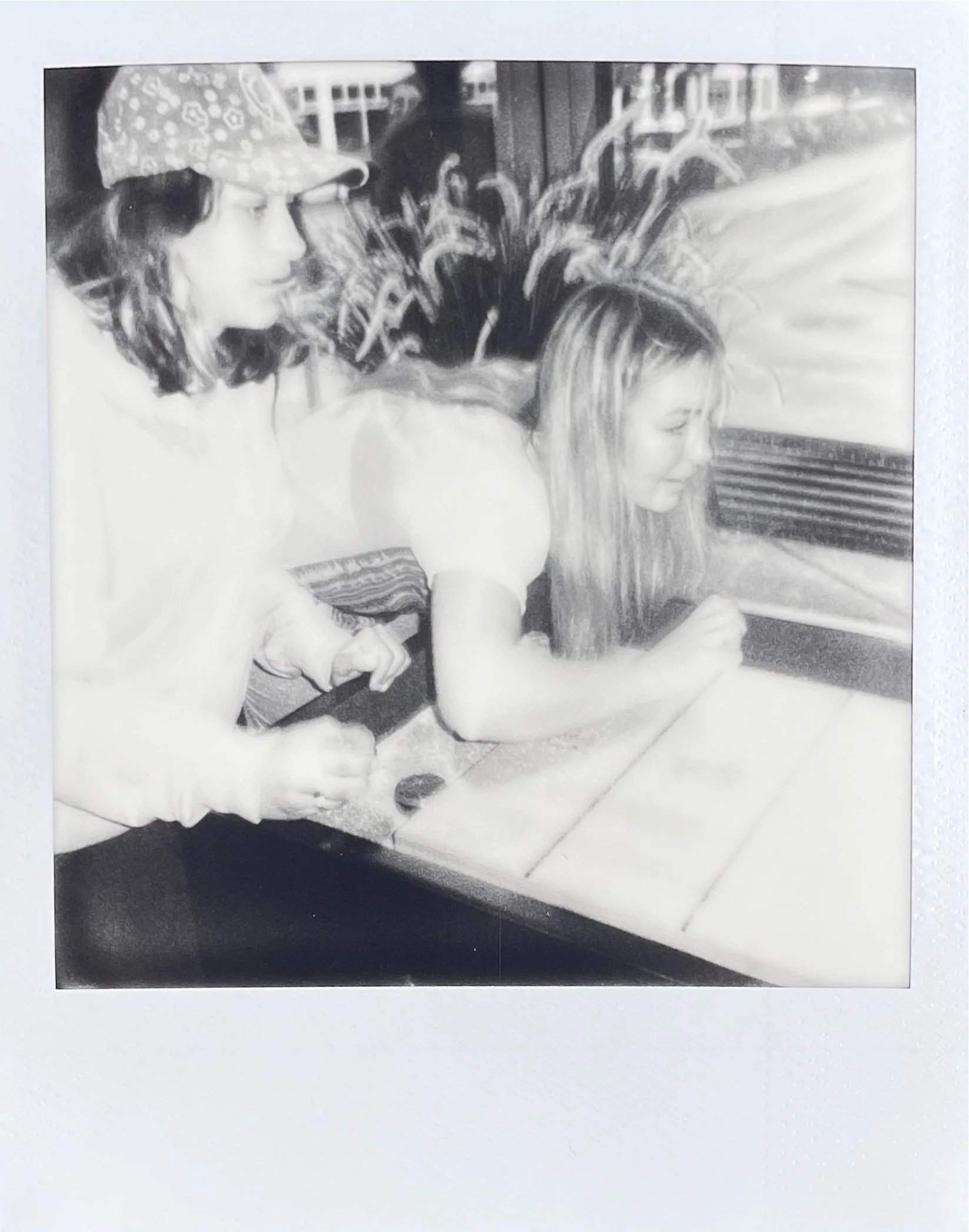 Vilma & Antonia escape the rain to play shuffleboard, Scandic Hotel. 