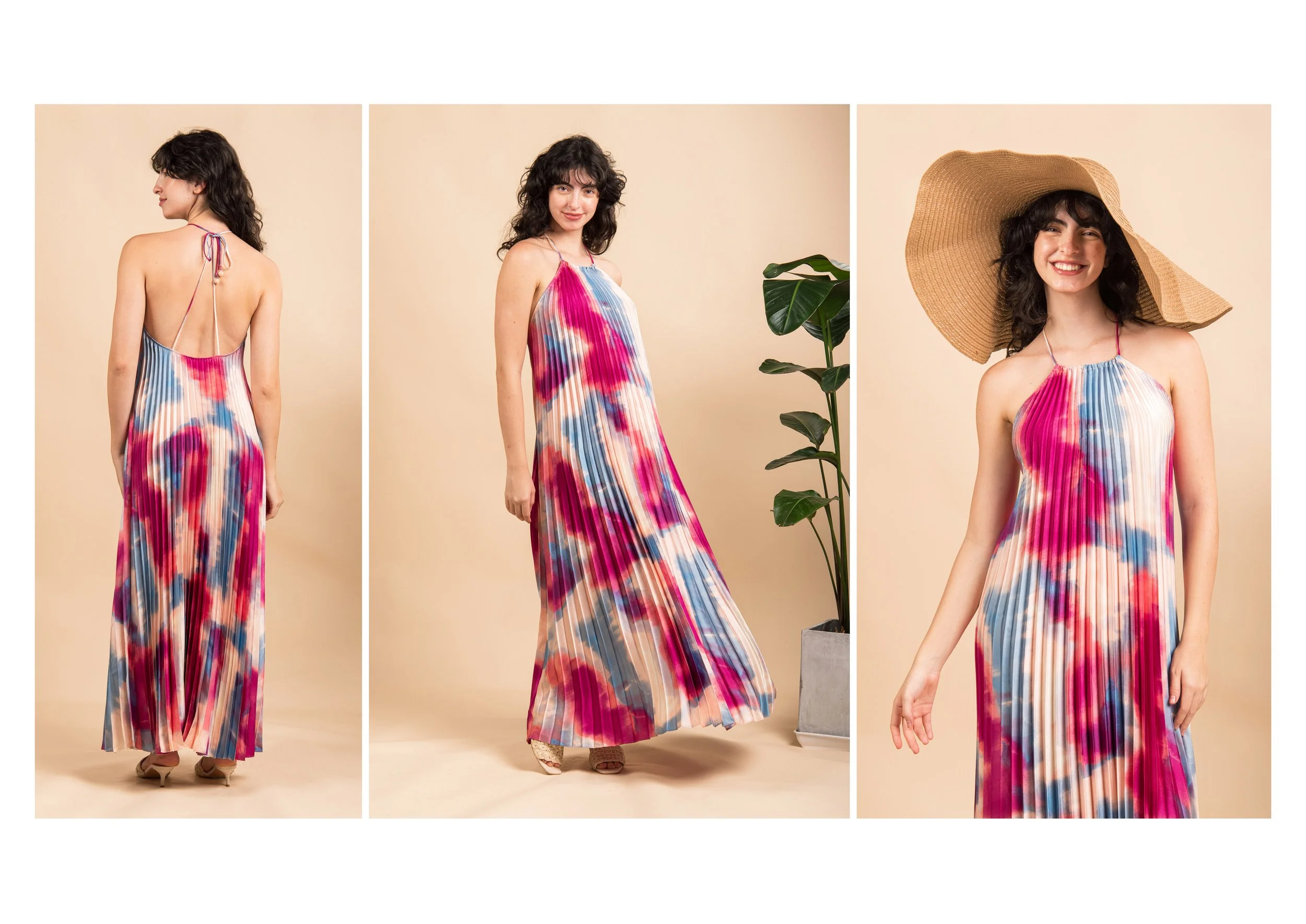 A woman modeling a colorful, pleated, tie-dye maxi dress in front of a beige background, shown from the back, side, and front with a large straw sunhat.