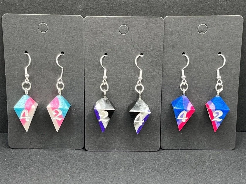 Happy Pride Month! Get your Pride Dice and Pride Dice Earrings! #pridemonth #queer #dnd #ttrpg #rpg