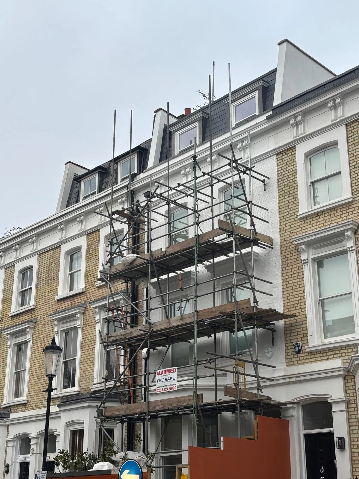 Building under renovation with scaffolding.