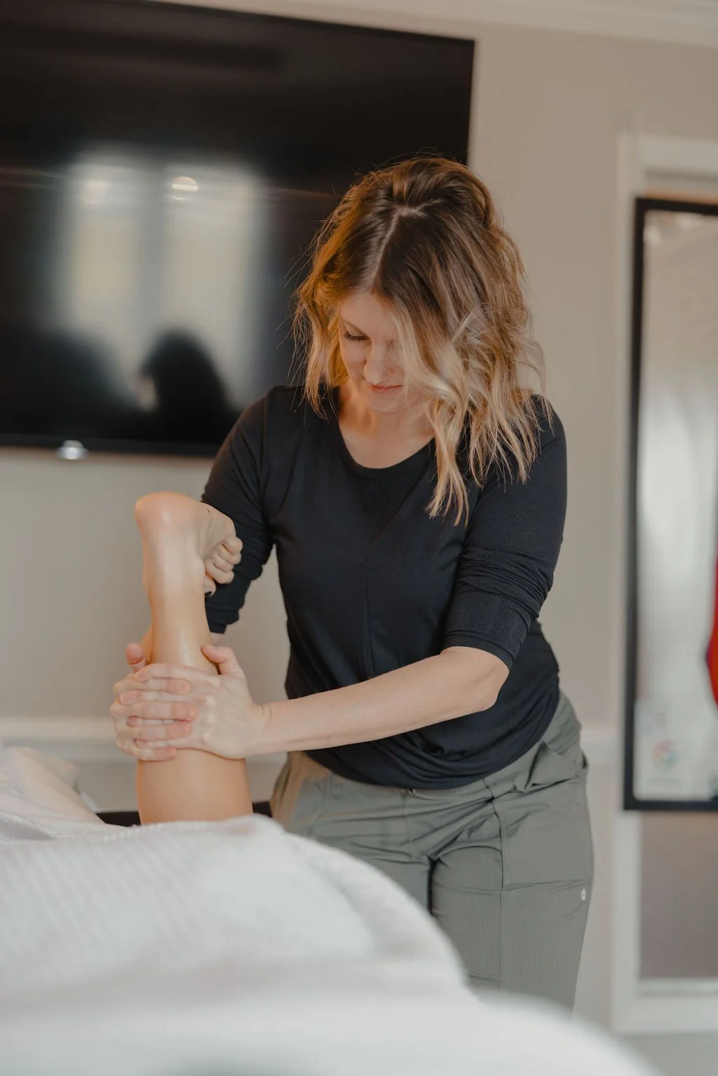 Woman receiving calf massage