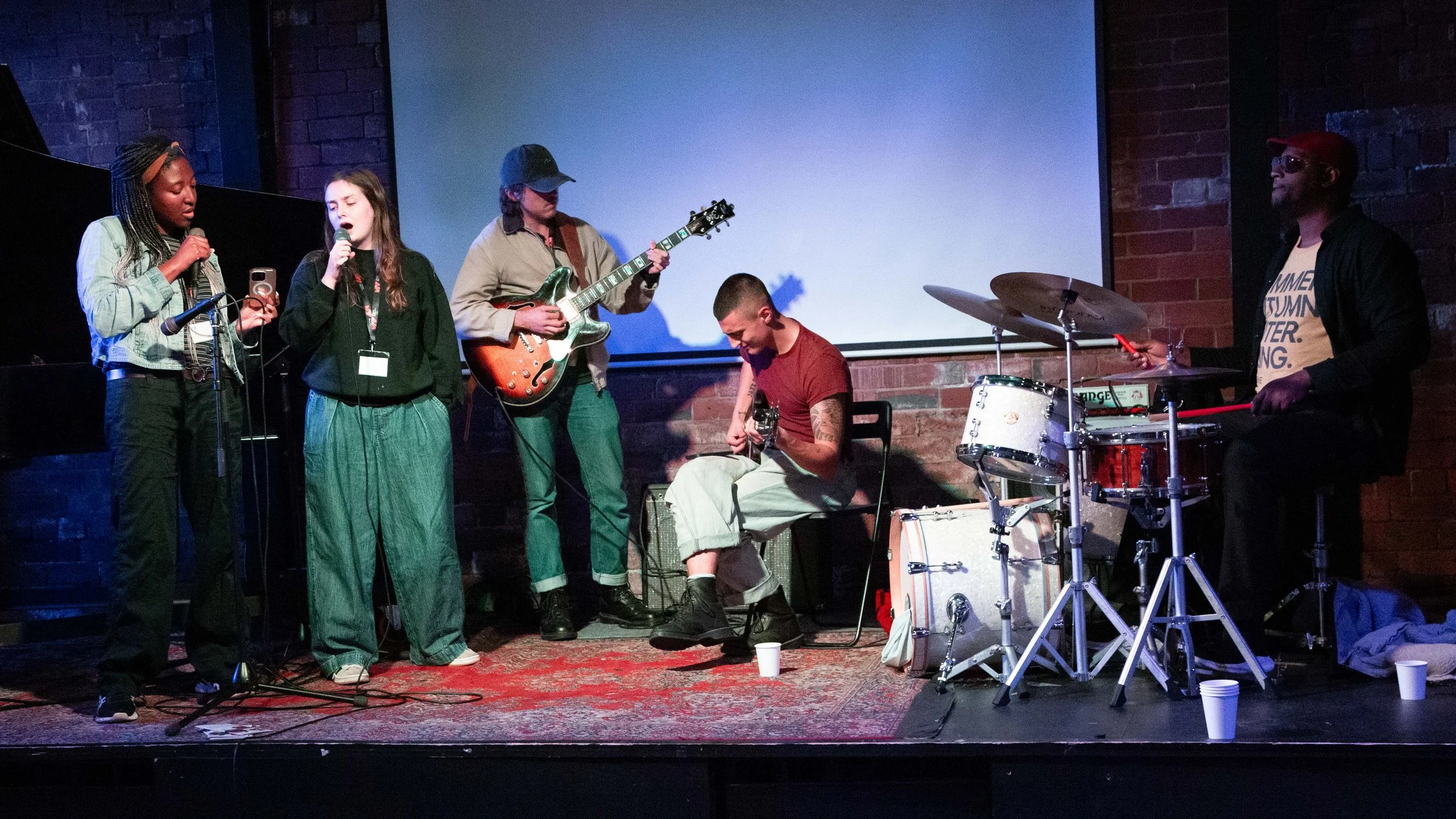 musicians on stage having a jam session