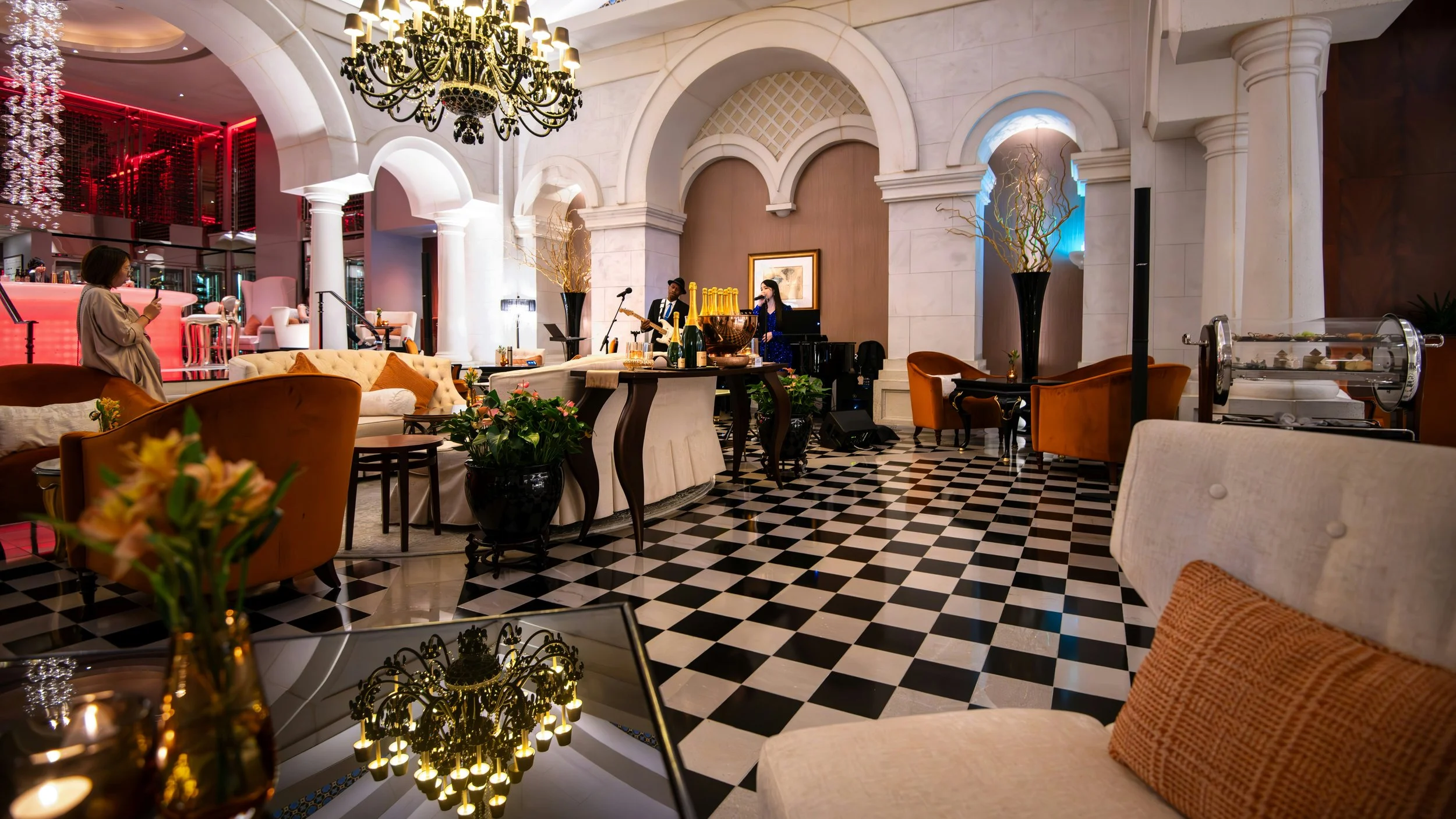 Ballroom with seating and checkerboard flooring