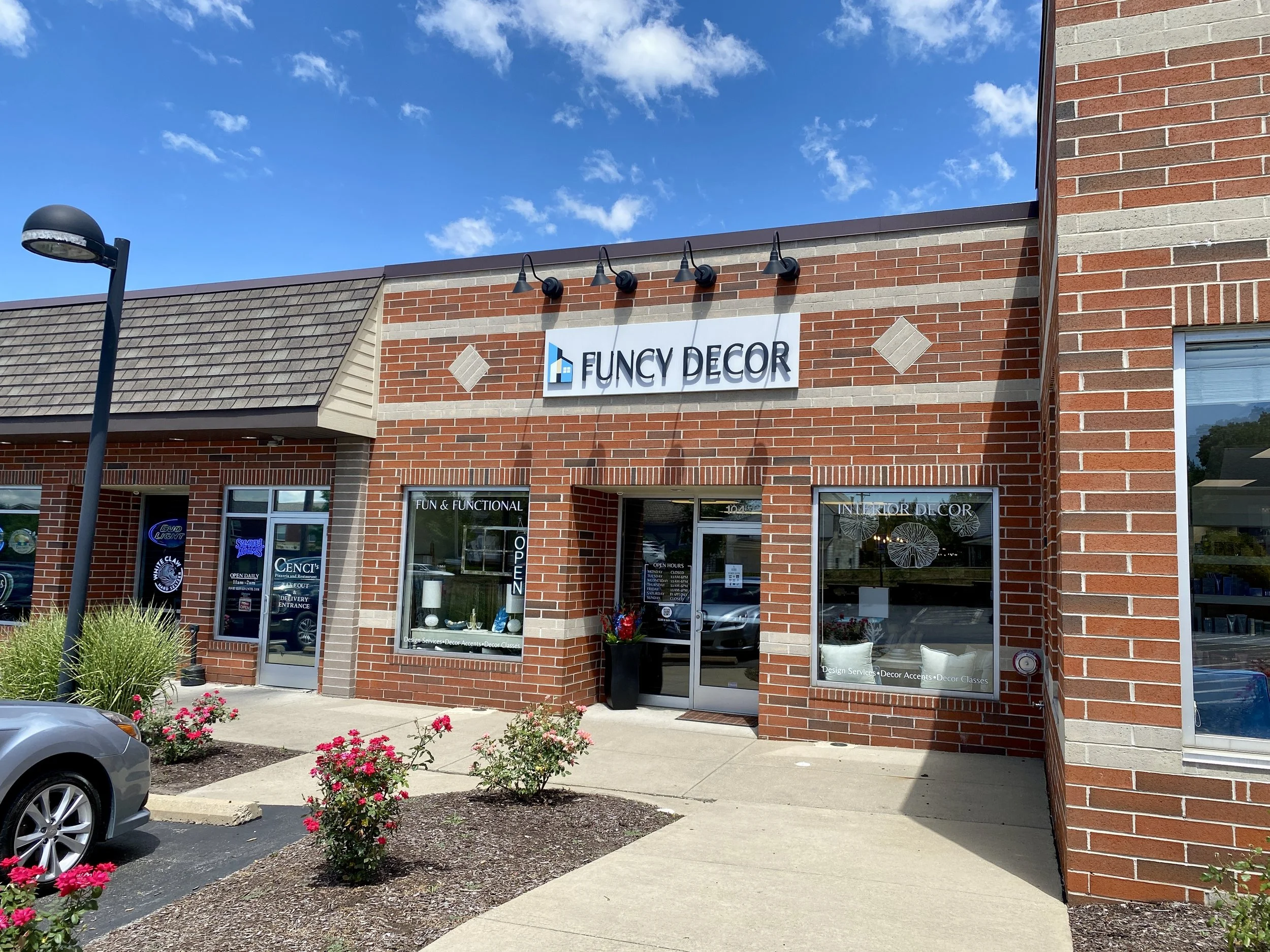 FUNCY DECOR storefront in Wexford, PA, a red brick building with a bright blue sky in the background.