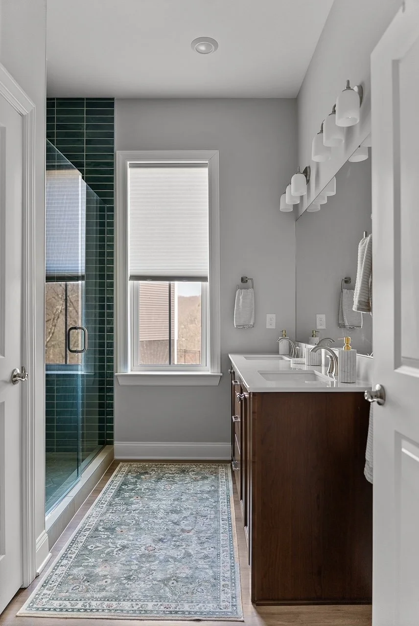 Modern classic emerald primary bath interior decorated by FUNCY DECOR.