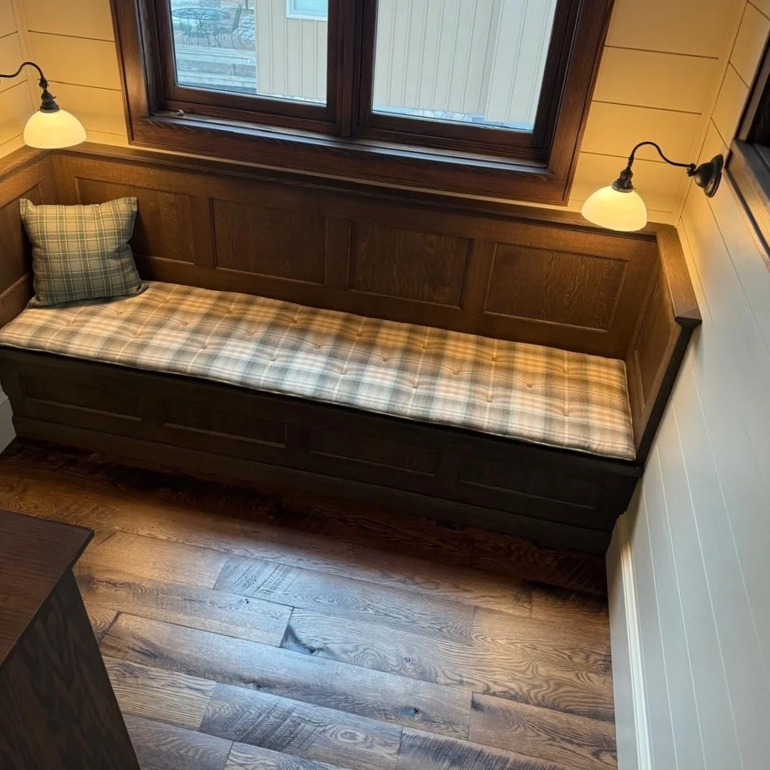 We crafted the custom tufted bench cushion in our Excelsior workroom for this cozy up north cabin! Looks like the perfect spot to curl up with a good book... 📖 

For cushions, throw pillows, and built-in banquettes, we are your go-to source. Just gi