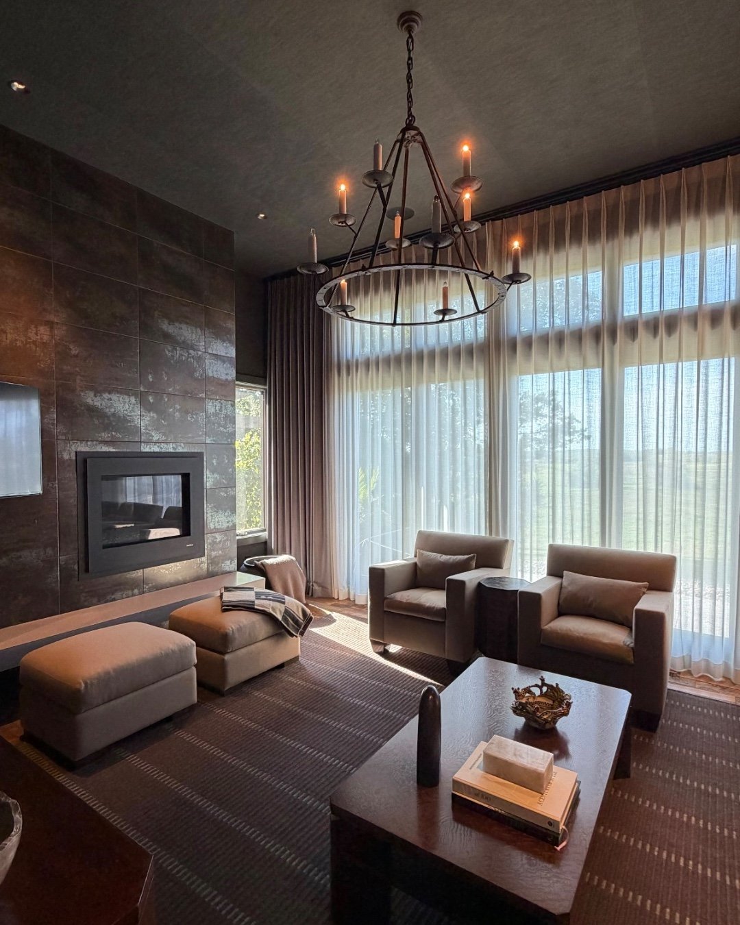 These custom motorized sheers fabricated and installed by Union Place using @somfy motorization filter the light just right and give the perfect level of privacy in this cozy den. We also love this stunning great room with custom floor to ceiling win