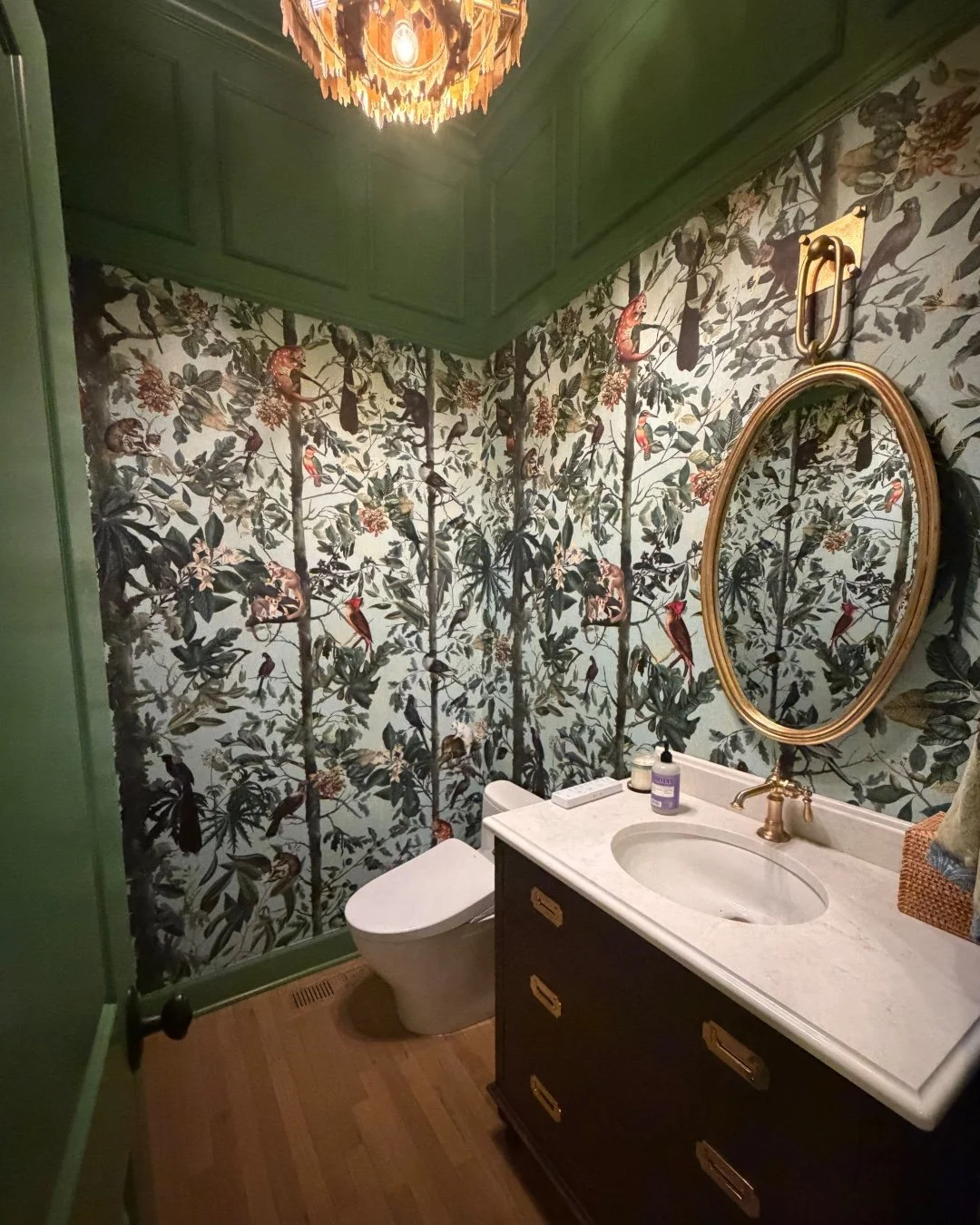 We love this jewel box powder room, and especially the incredible @mindthegap wallpaper and stunning @whiteoakcabinetry that was selected! If you're hesitant to "go bold", waver no longer. This room is proof that saturated color and excitin