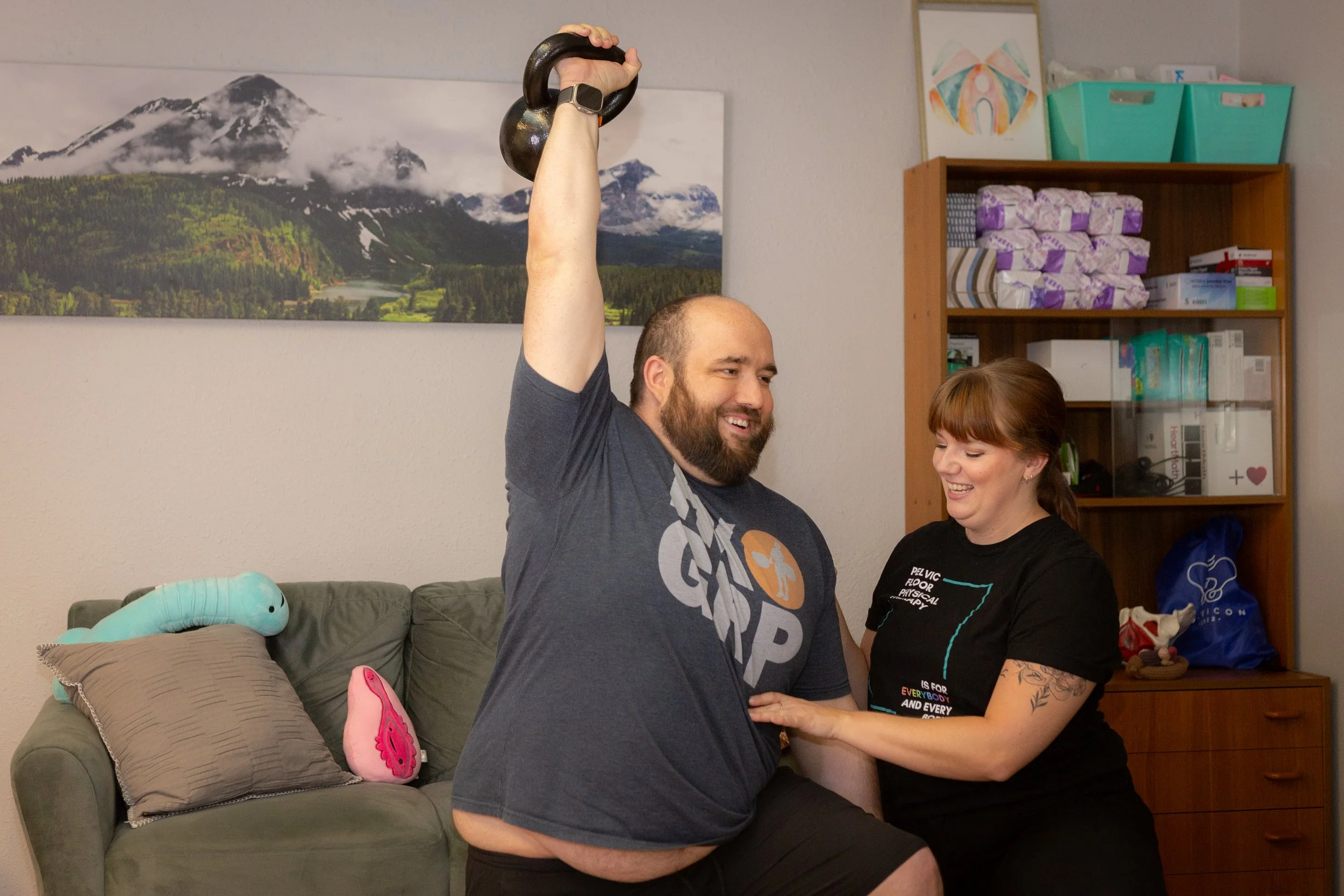 Krystyna Supporting Patient with Kettlebell Exercise