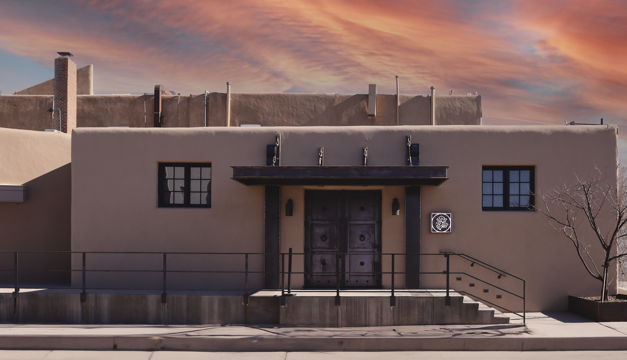 Sunset on the facade of Milk of the Poppy