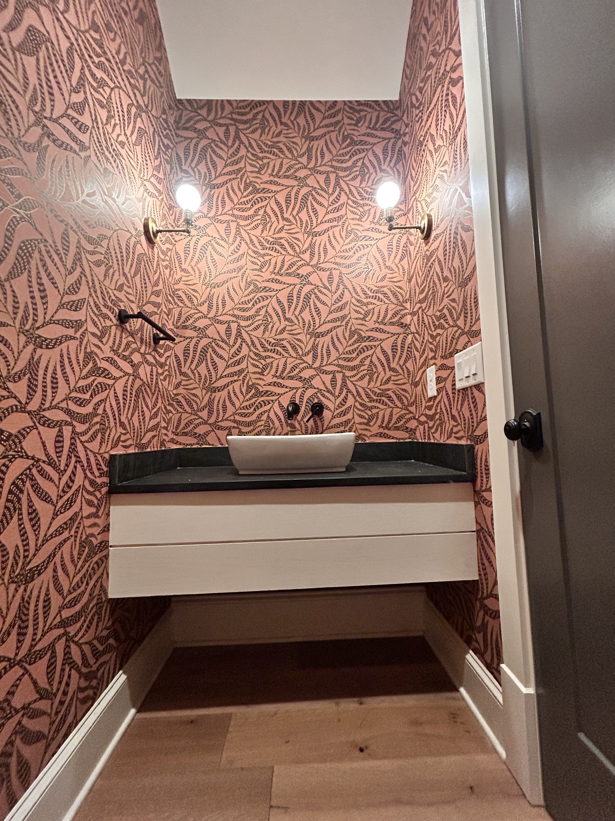 Powder Bathroom wallpaper in pink and brown installed in Lake Oconee by Second Rodeo Wallpaper