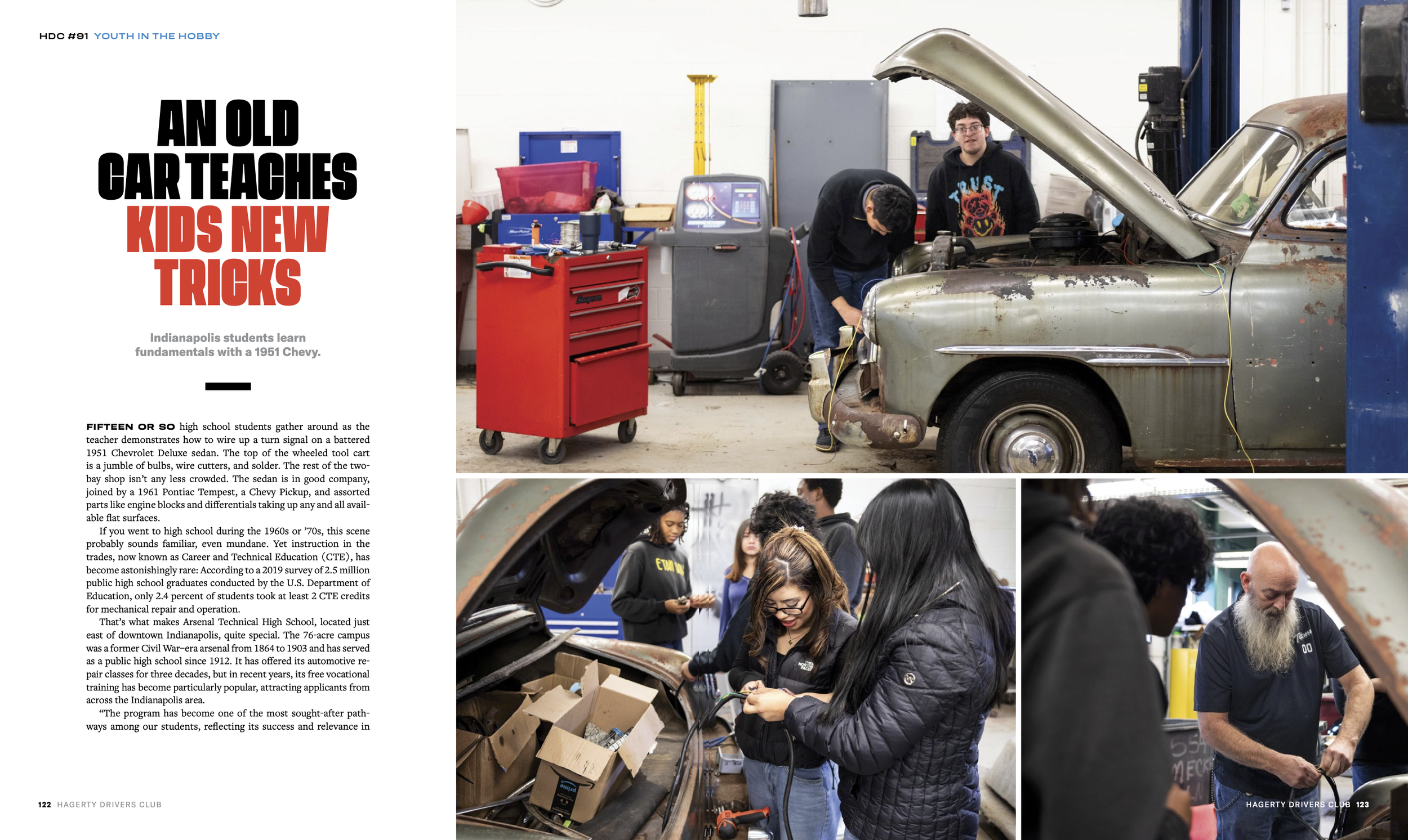 High school students working on a vintage car inside a workshop, with various tools and equipment around.