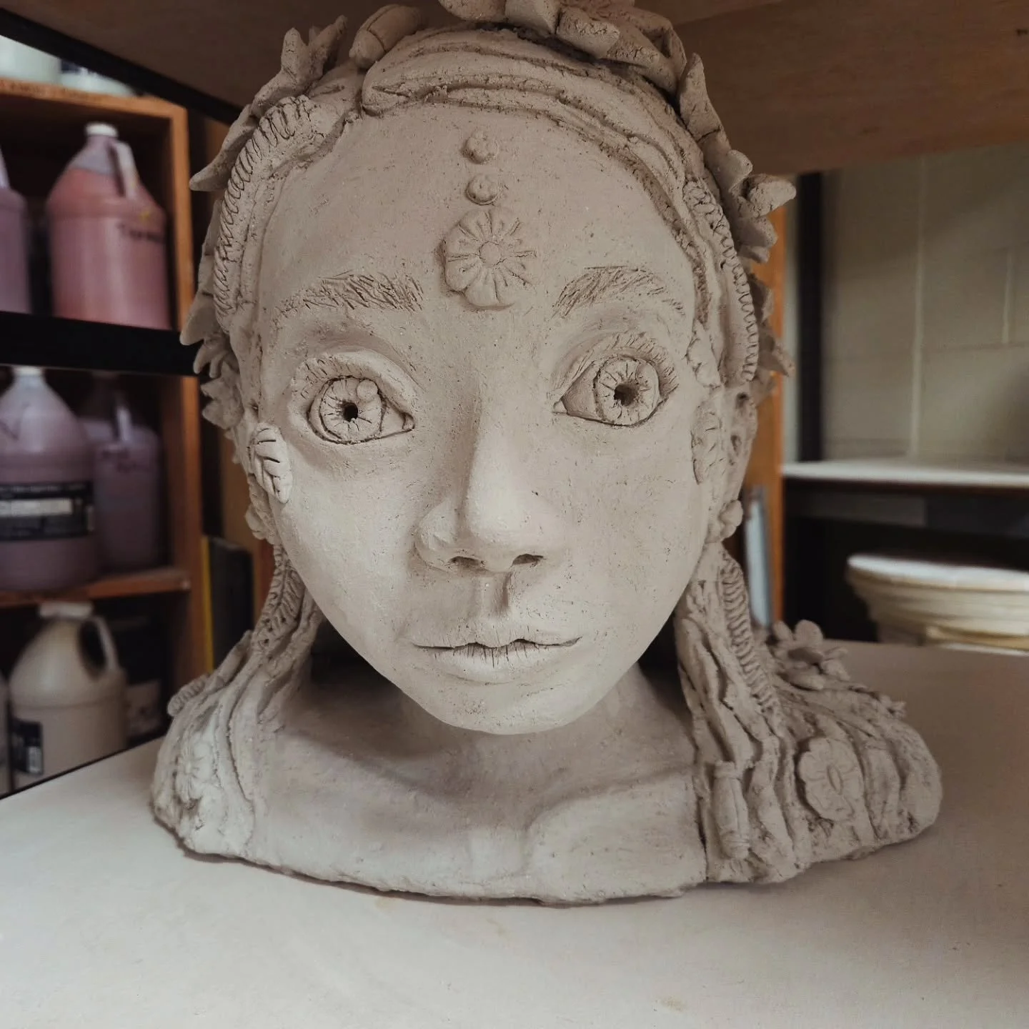 Garden Guardian: Summertime Janis. I love all the details: sunflowers and black eyed susans in her crown, fireflies and wildflowers in her hair, and wheat for the harvest.
.
I'll be firing her in 2 weeks or so! She is part of my MA show, I'll be pre