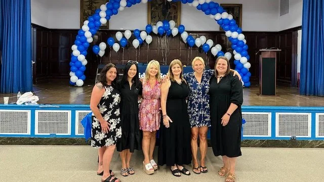 PTA members and administration posing