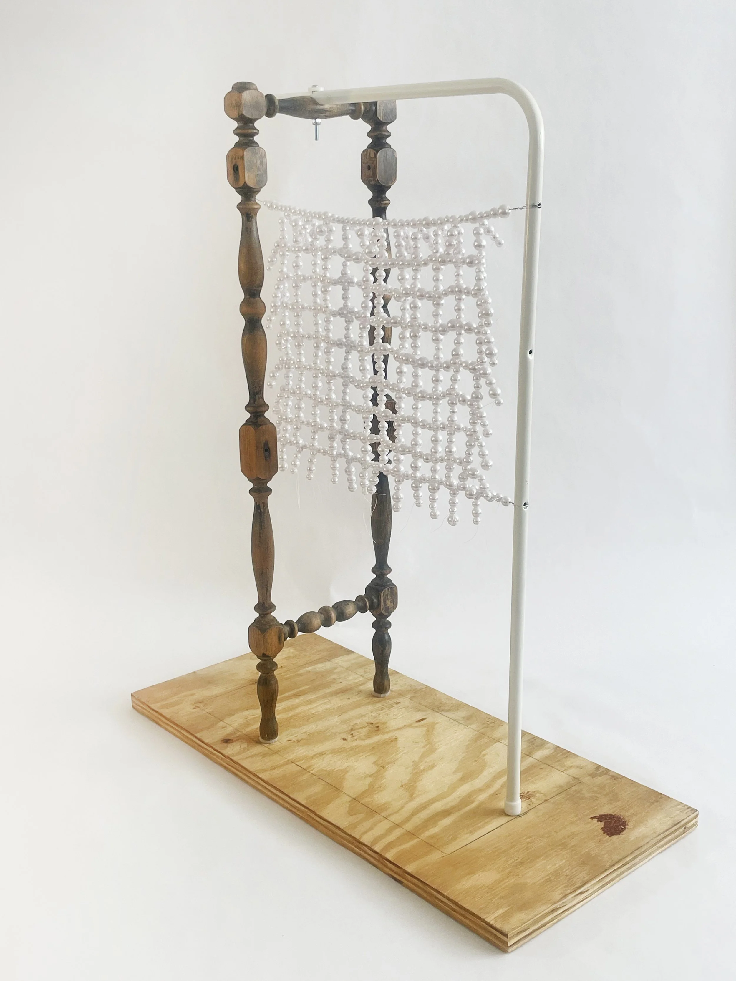 Untitled (radiator), 2026, 28h x 24x x 11d - salvaged turned wood, Ikea aluminum legs, plastic pearl beads, found plywood, wire, thread, thread rod